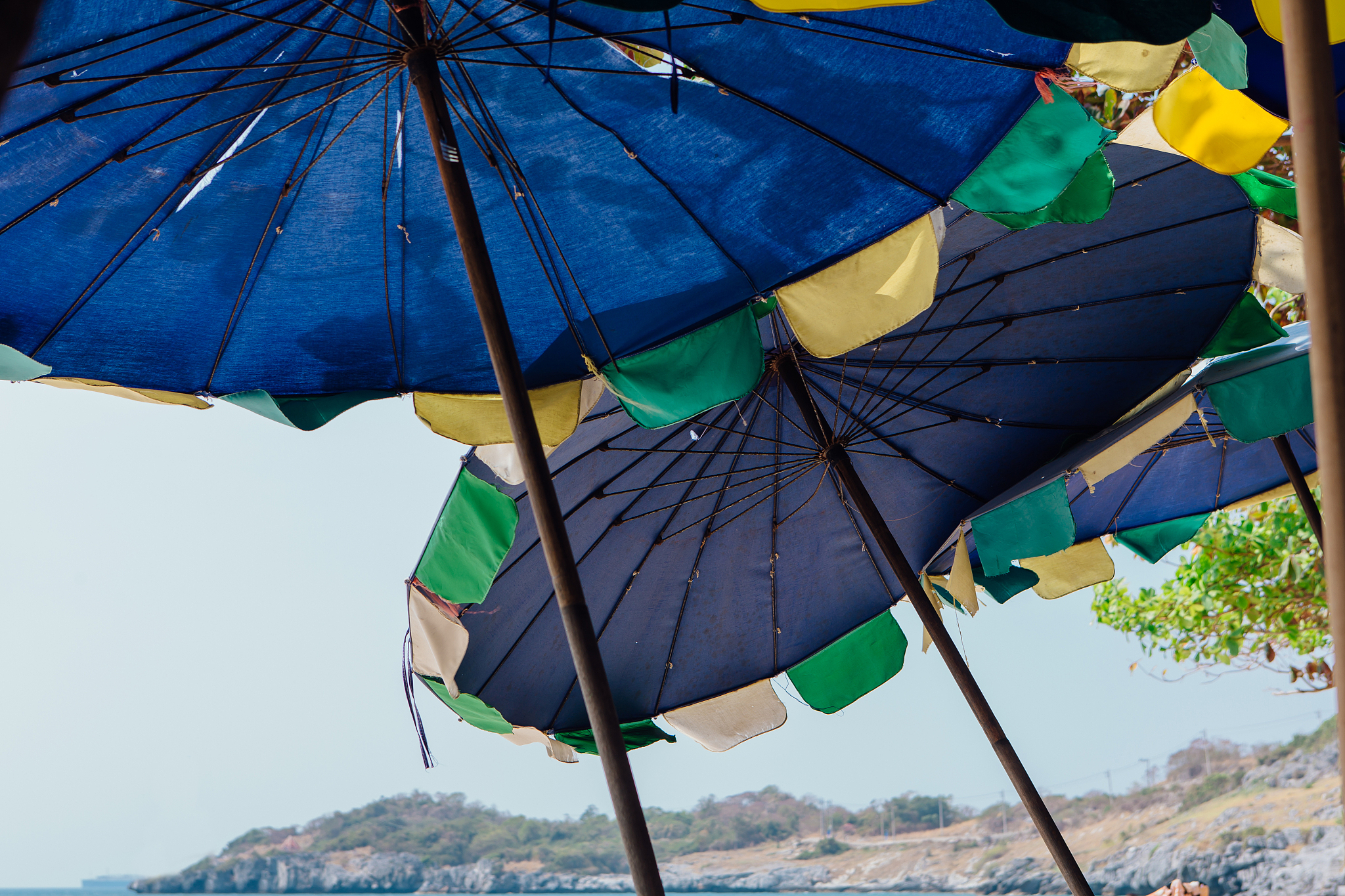 blue beach umbrellas for sun protecrion closeup background.