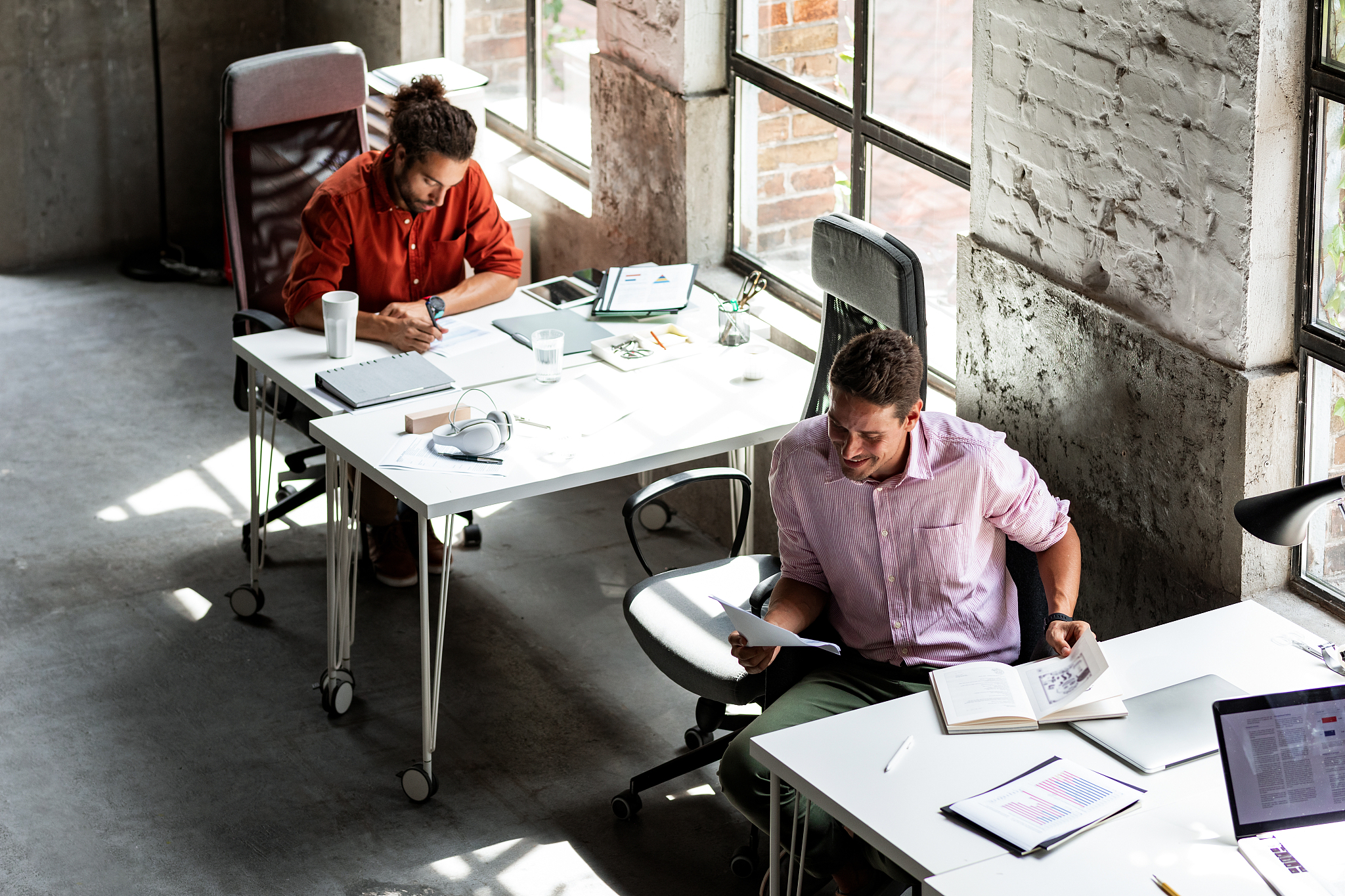 two men working in an open space office, a wide angle view