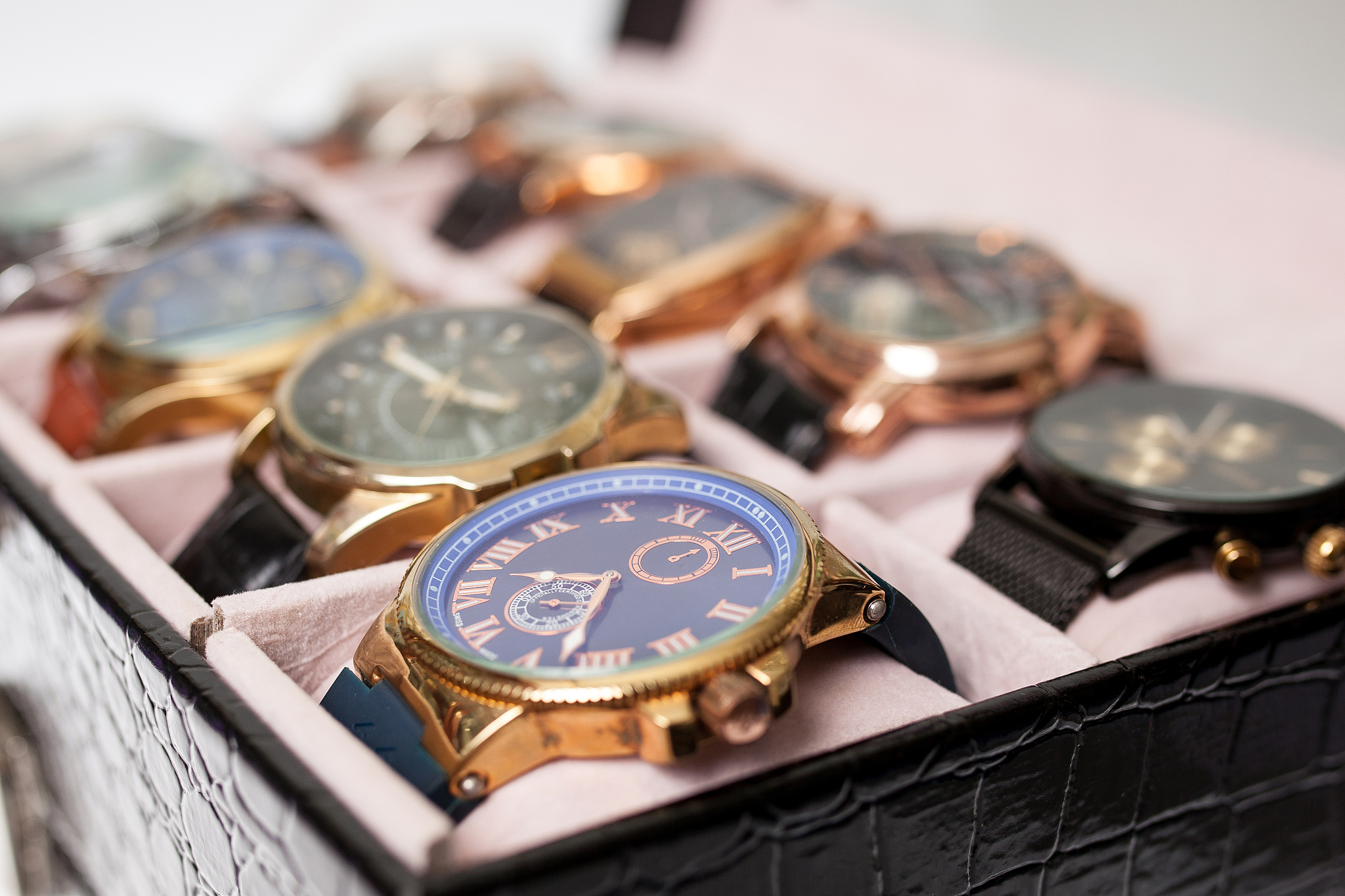 storage box with collection of men wrist watches