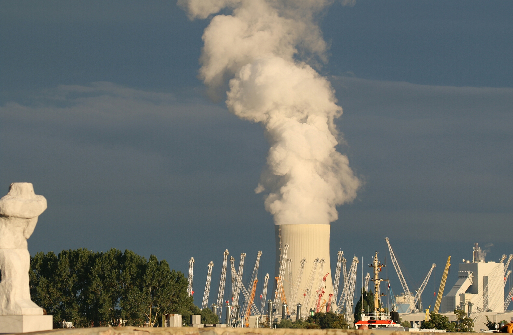 smoke emitting from factory against sky