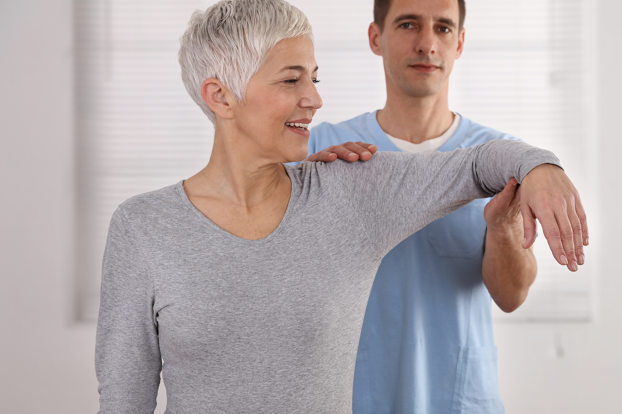 mature woman having chiropractic back adjustment. osteopathy, ph