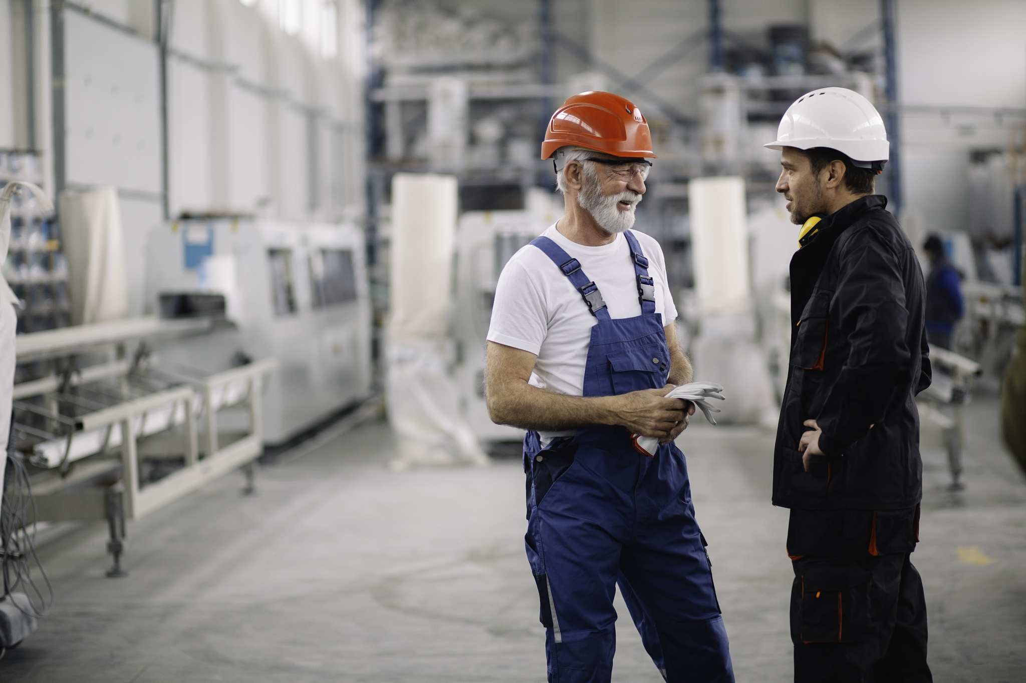 colleagues working together. workers in factory.
