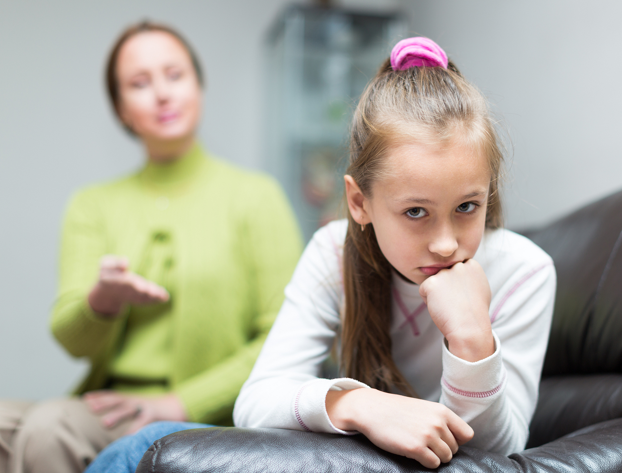 woman berating daughter in home
