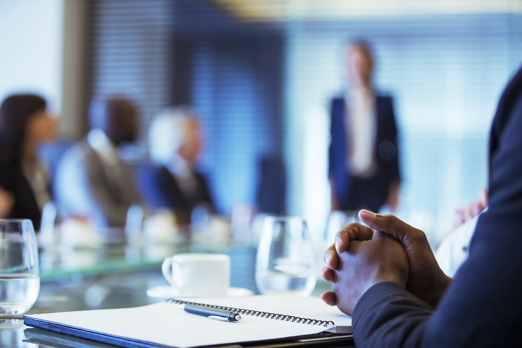 businessman sitting at conference table in conference room with 
