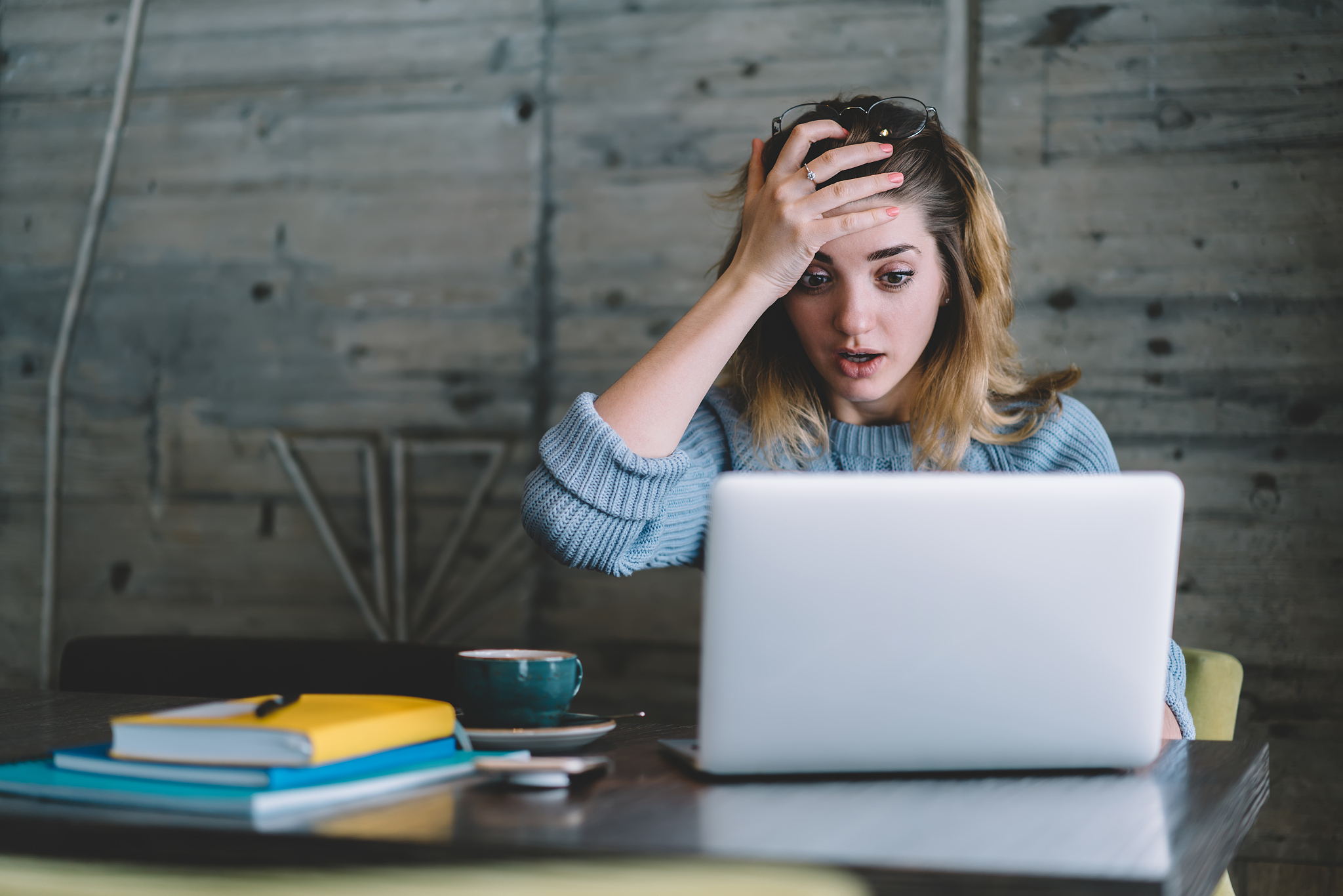 shocked female student receiving email from manager about upcomi