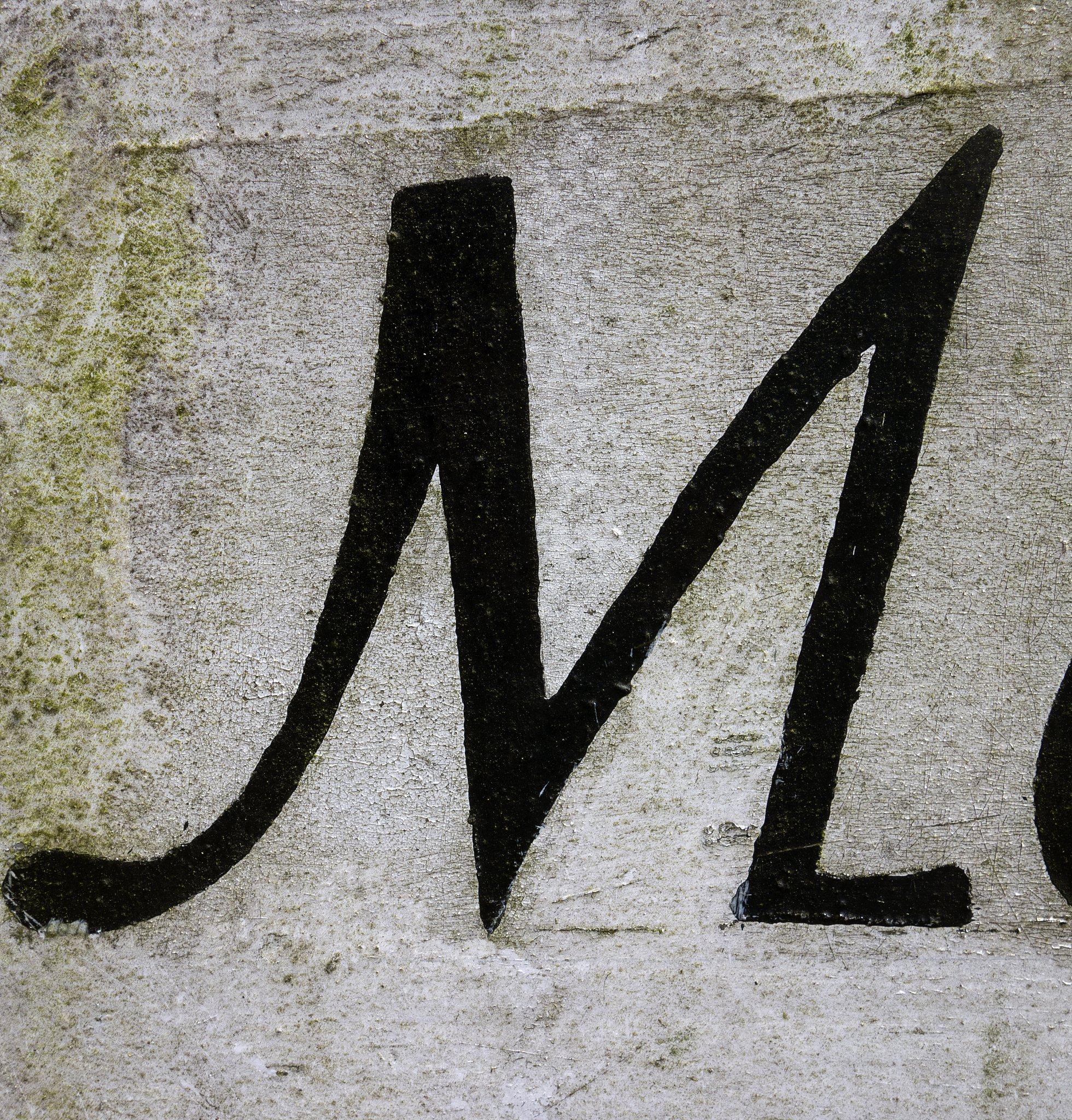 written wording in distressed state typography found letter m