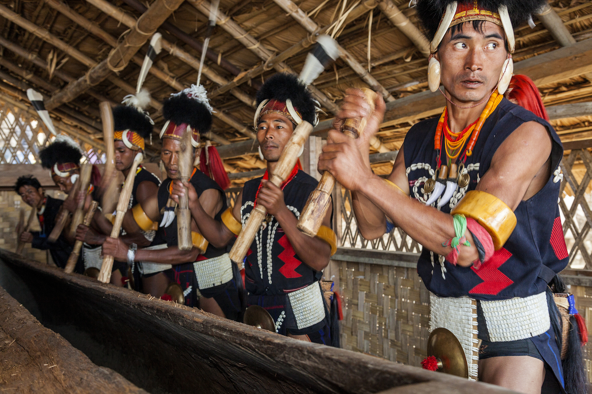 chang tribe beating tribal drum, nagaland, india
