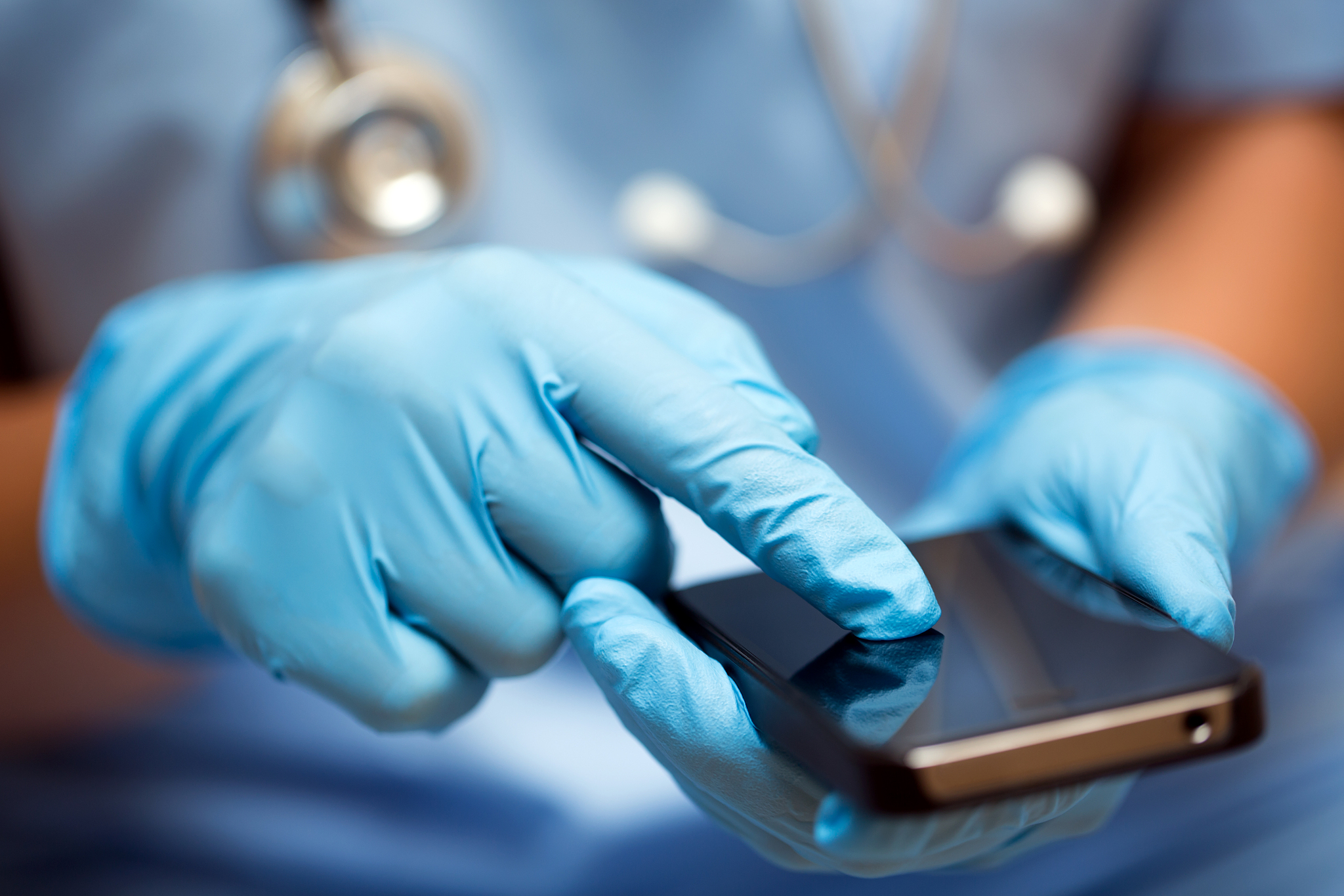 a medical professional with a smartphone