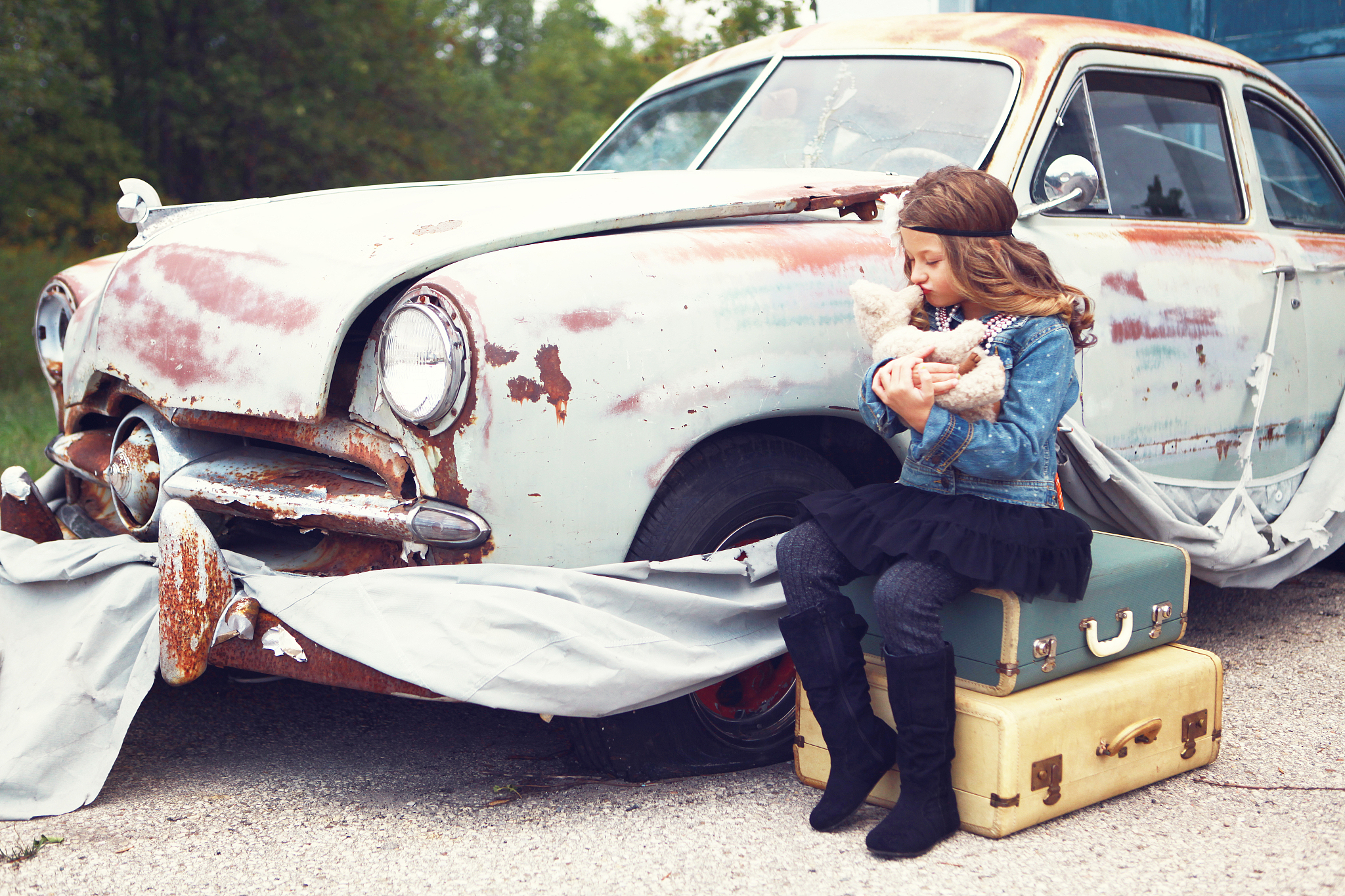 little girl by antique car