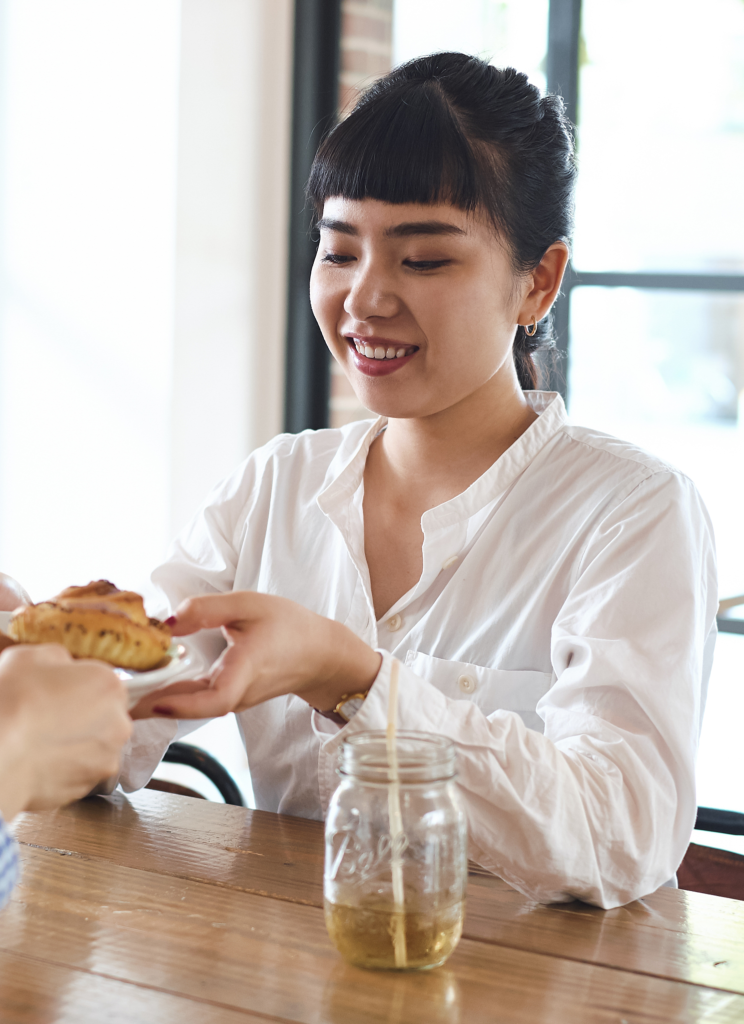 a woman relaxing at a cafe