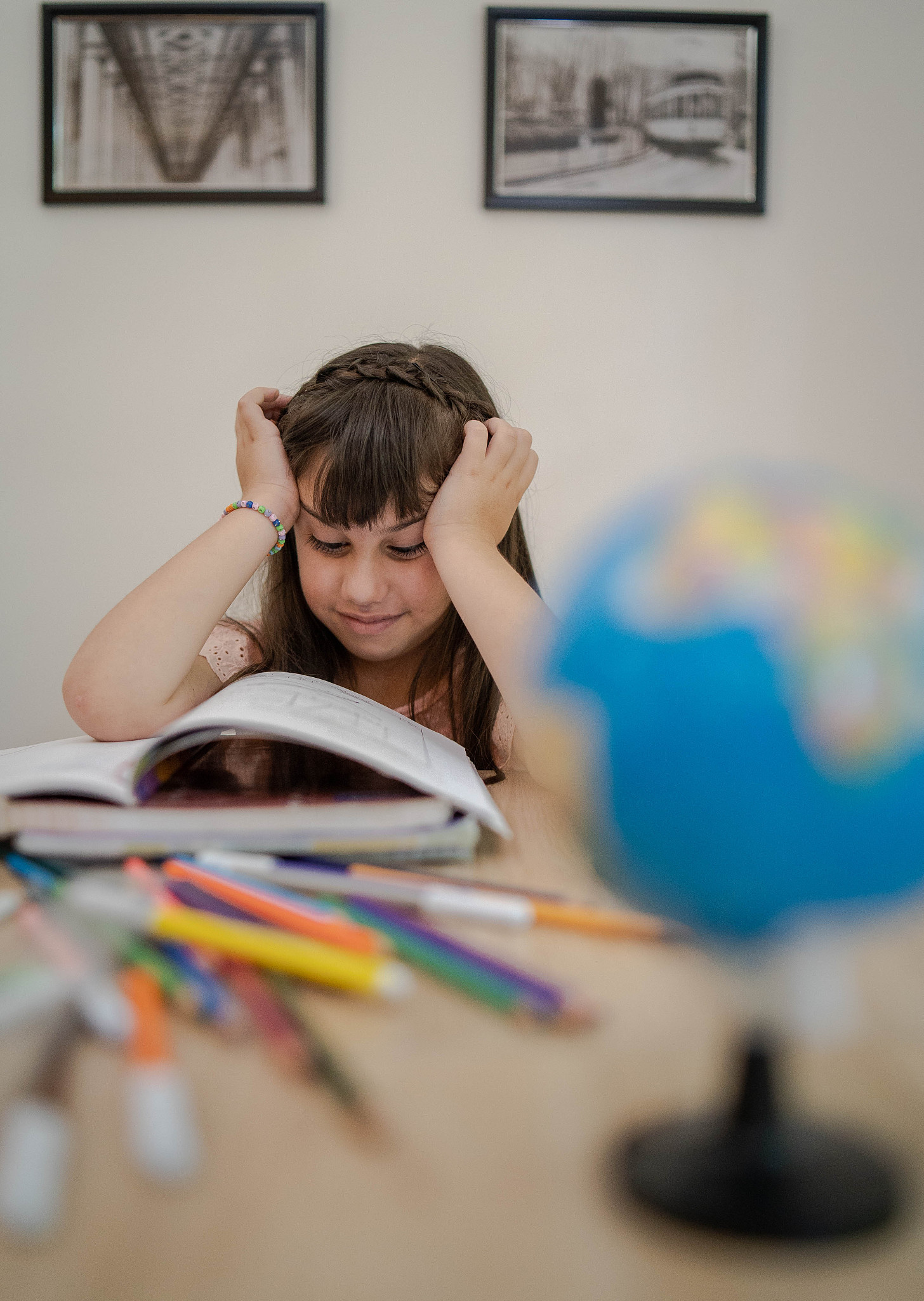 cute little girl working homework-learning from home concept