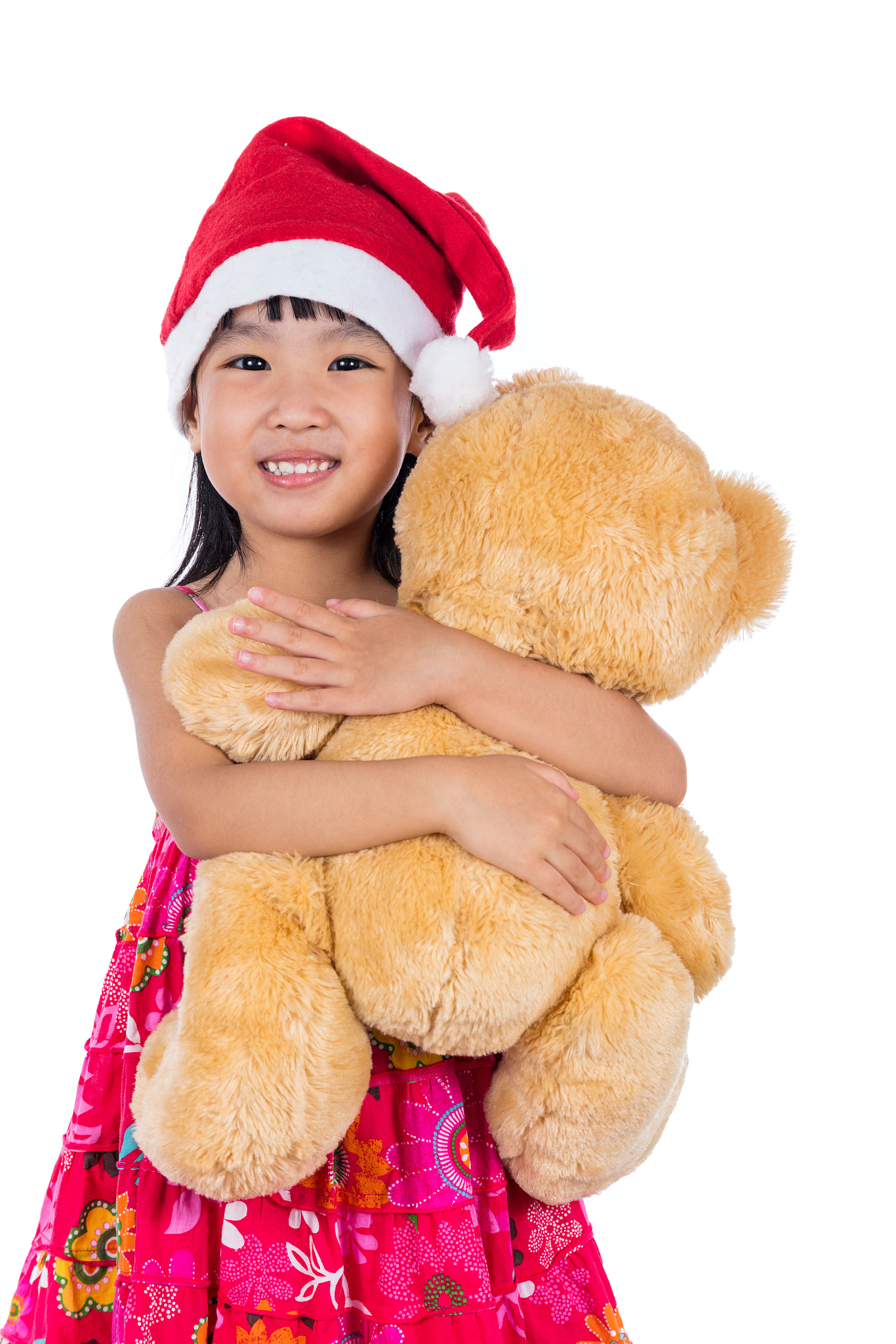 asian chinese little girl wearing santa hat holding teddy bear