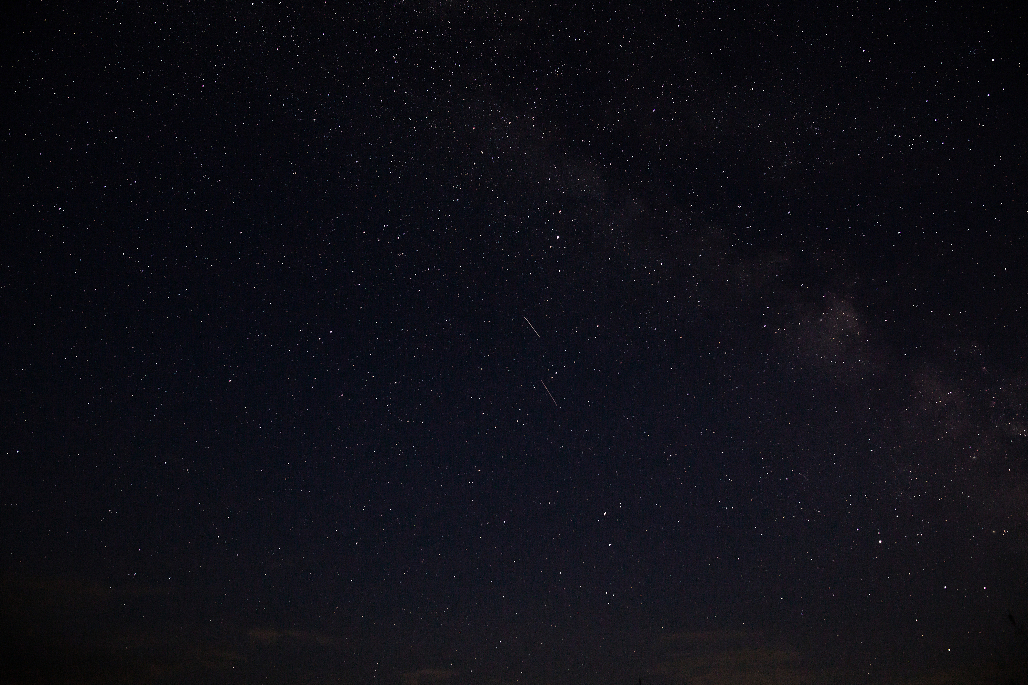 amazing starry night sky above lake in mountains. beautiful nigh