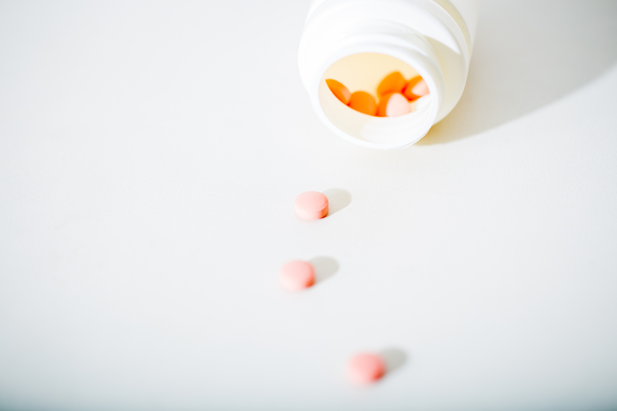 macro shot of tablets and container