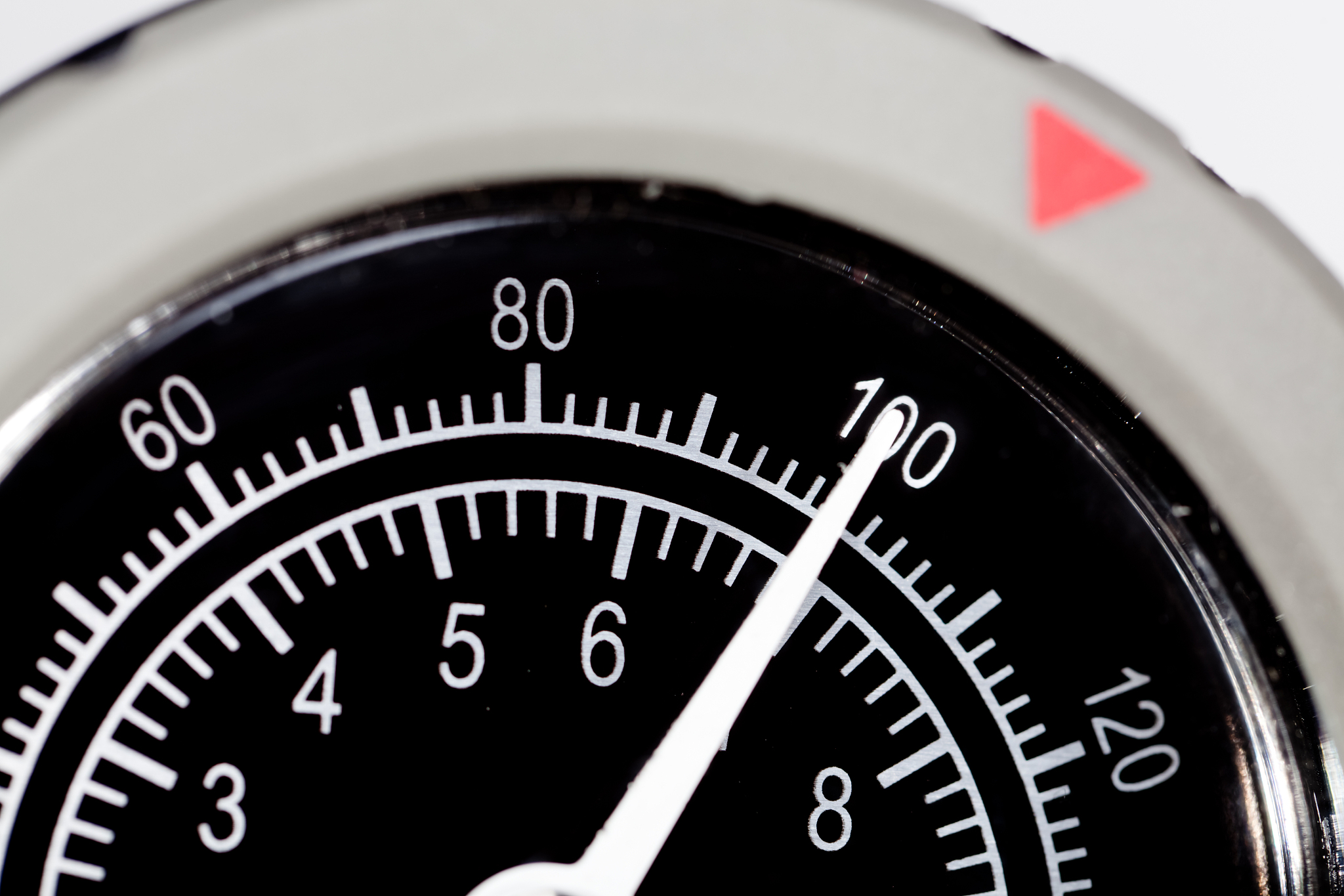 close up of pressure gauge dial at 100