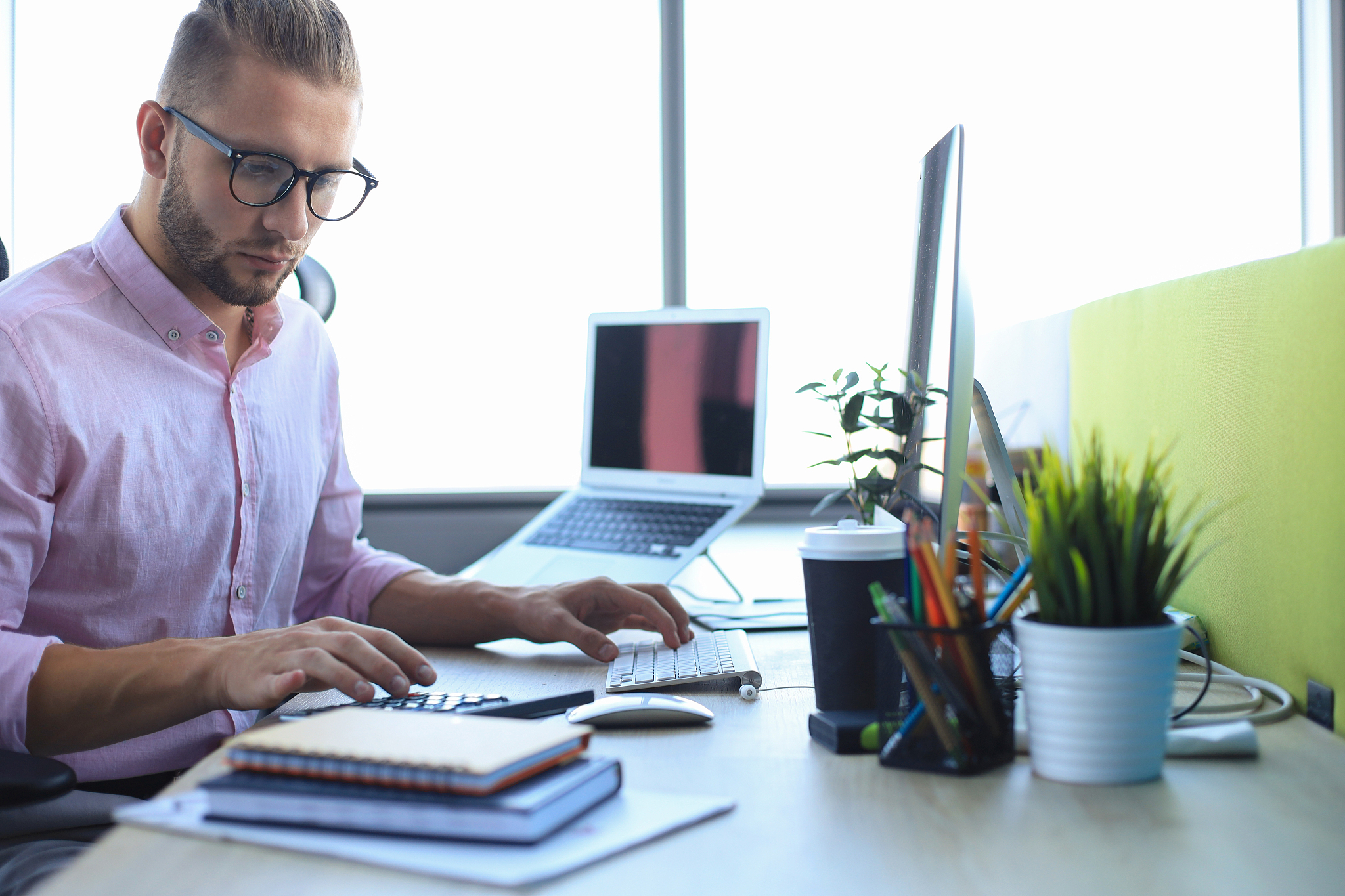 thoughtful young business man in shirt working using computer wh