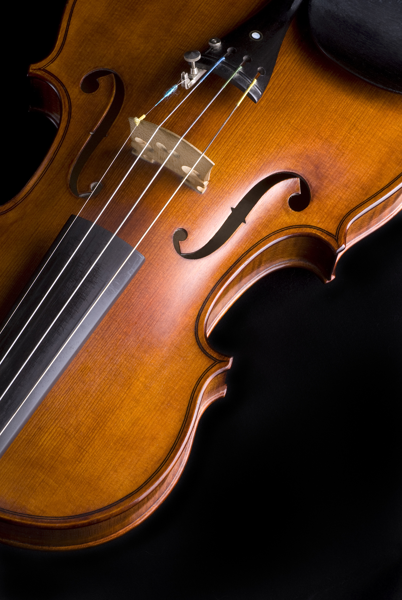 violin close up on black; room for copy (series)