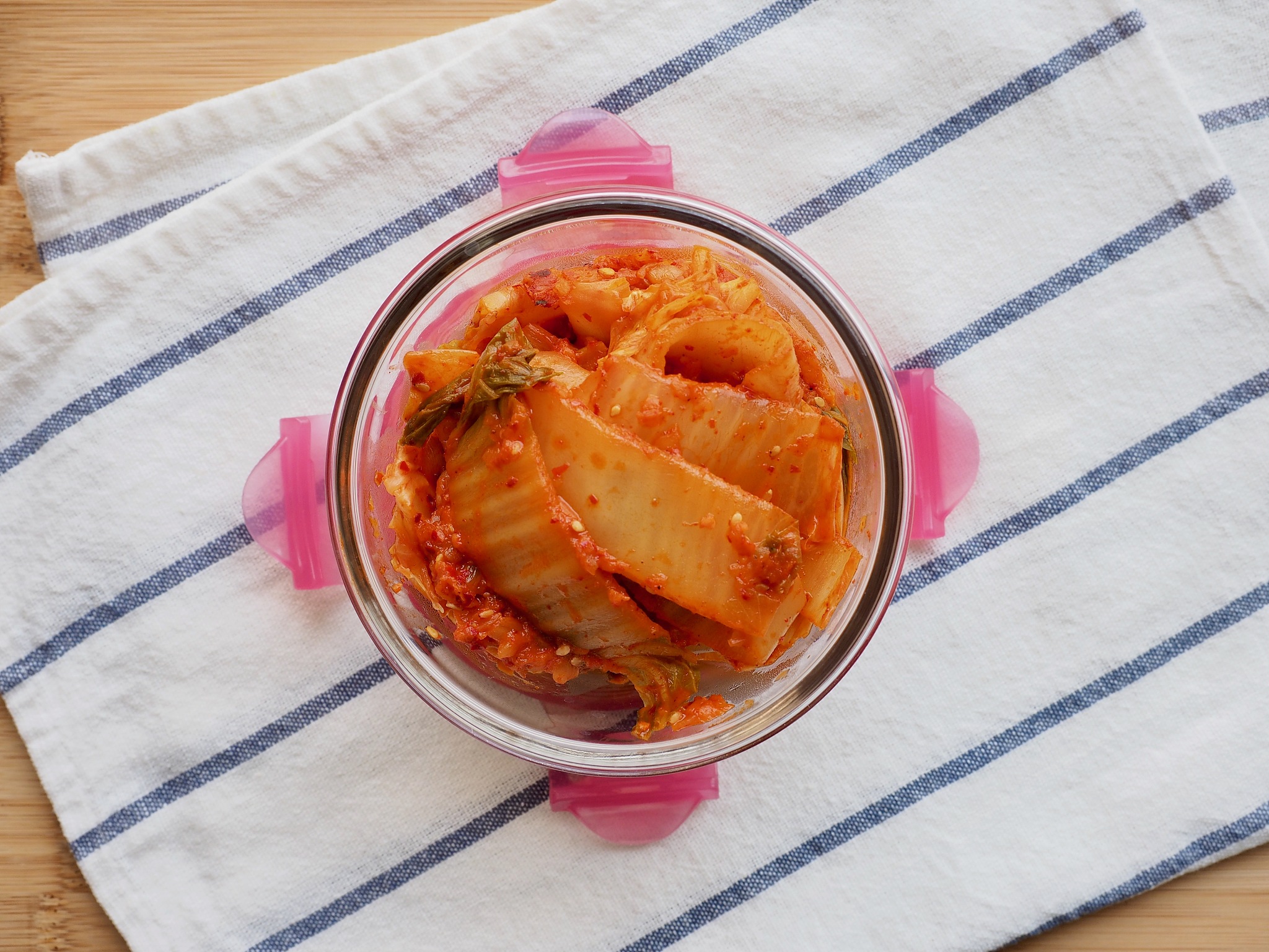 korean traditional food, stir-fried kimchi in a glass container