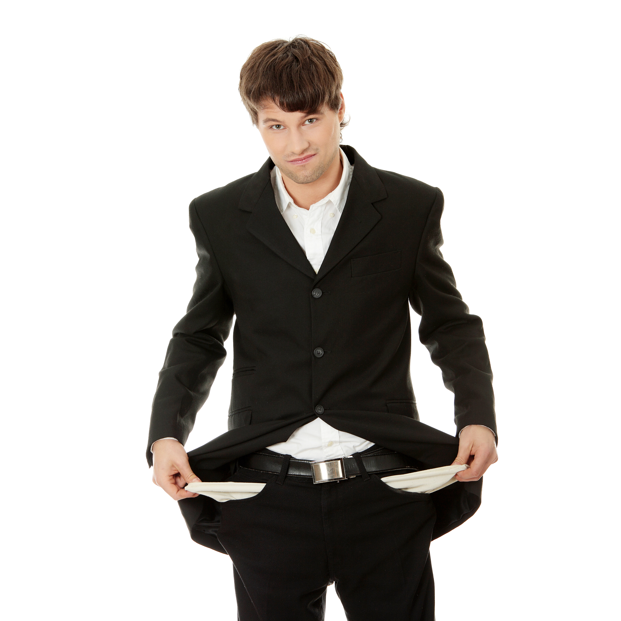 portrait of businessman showing empty pockets standing against w