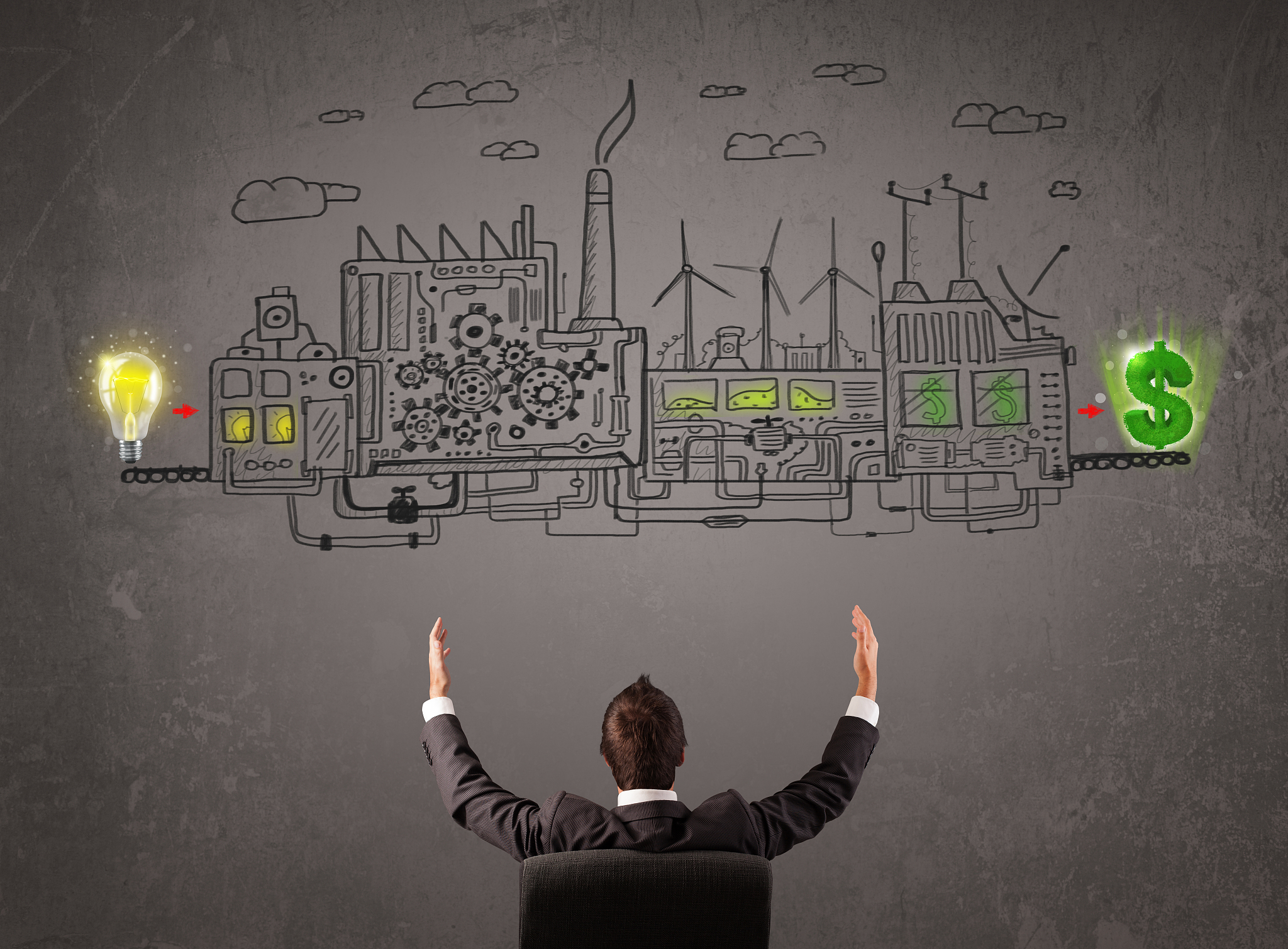 business man looking at factory that makes money from ideas