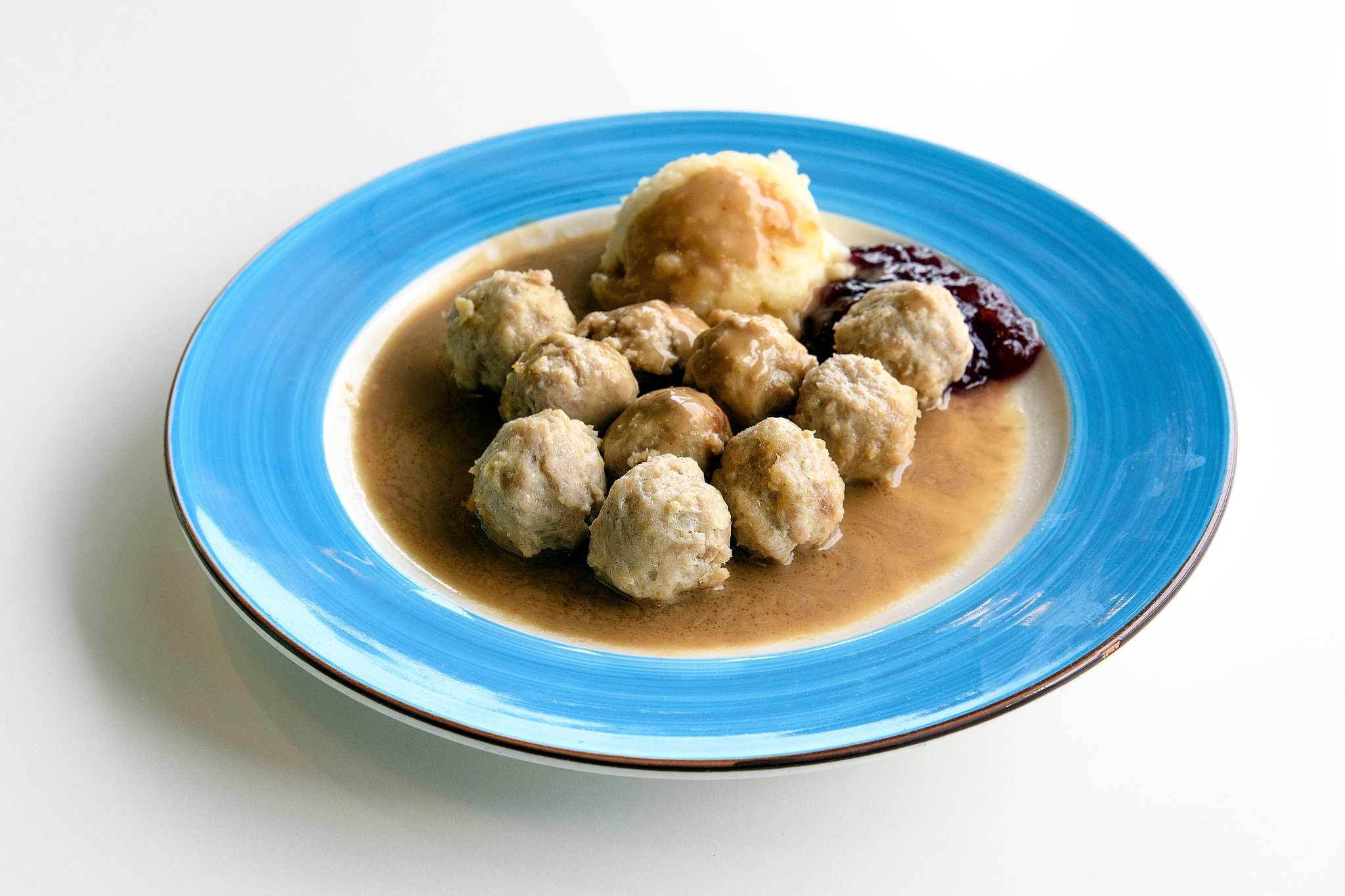 high angle view of fresh chicken meatballs served in plate on wh