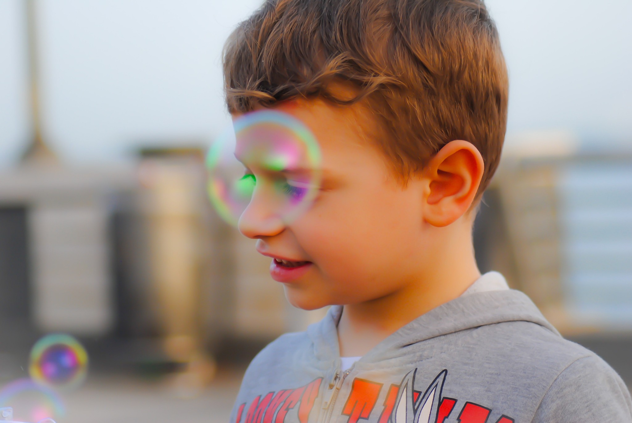 close-up of smiling boy with bubbles