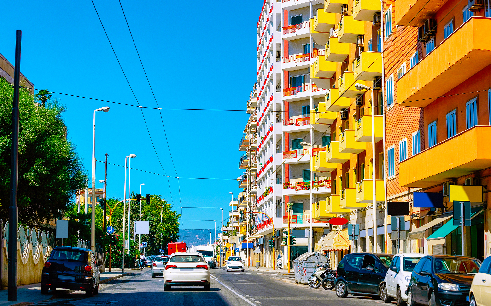 street view of road with car traffic in cagliari reflex