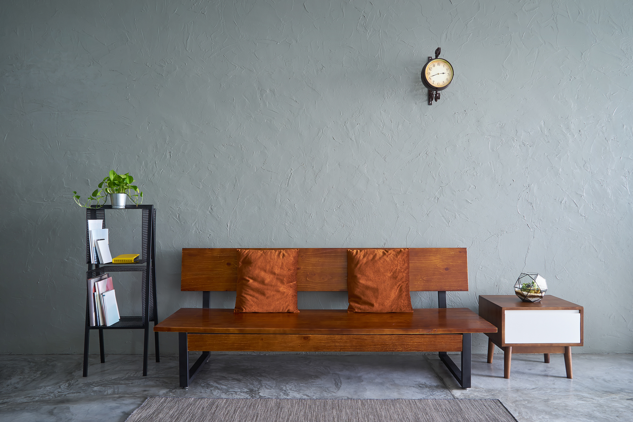 modern living room with wooden bench sofa ,green plant , wooden 
