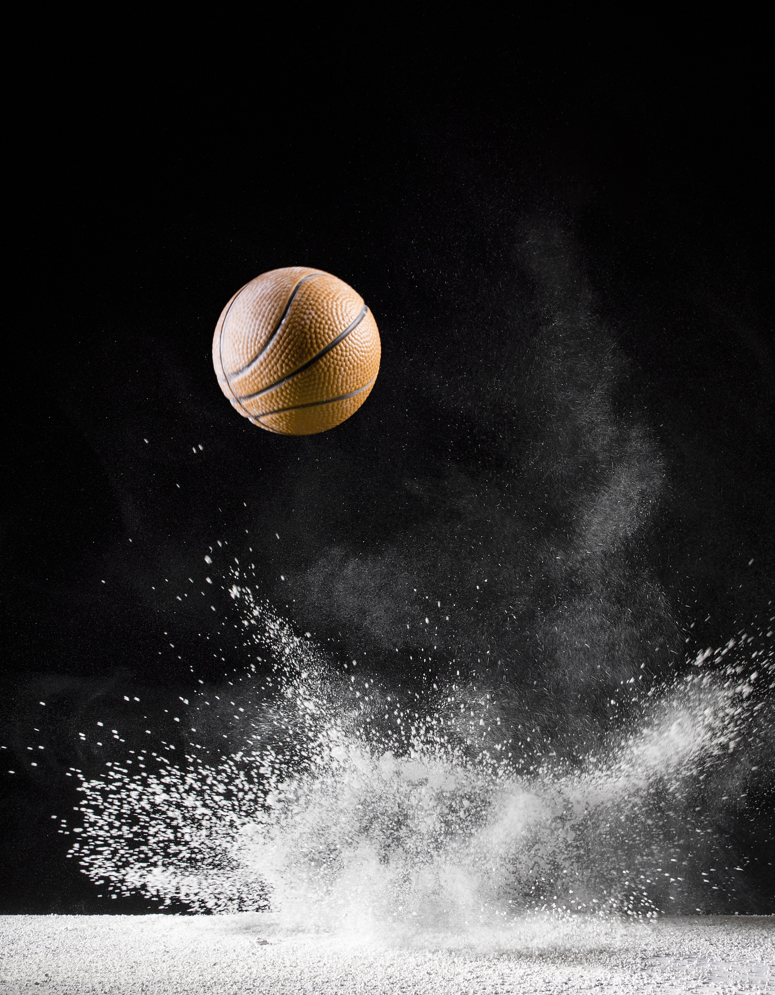 impact and rebound of a ball of basketball on a surface of land 