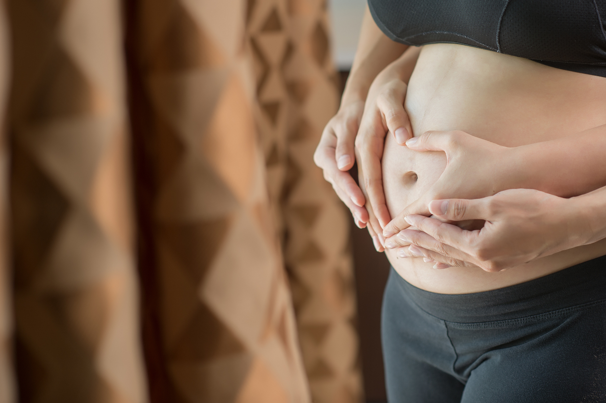 beautiful young pregnant woman and her husband caressing her pre