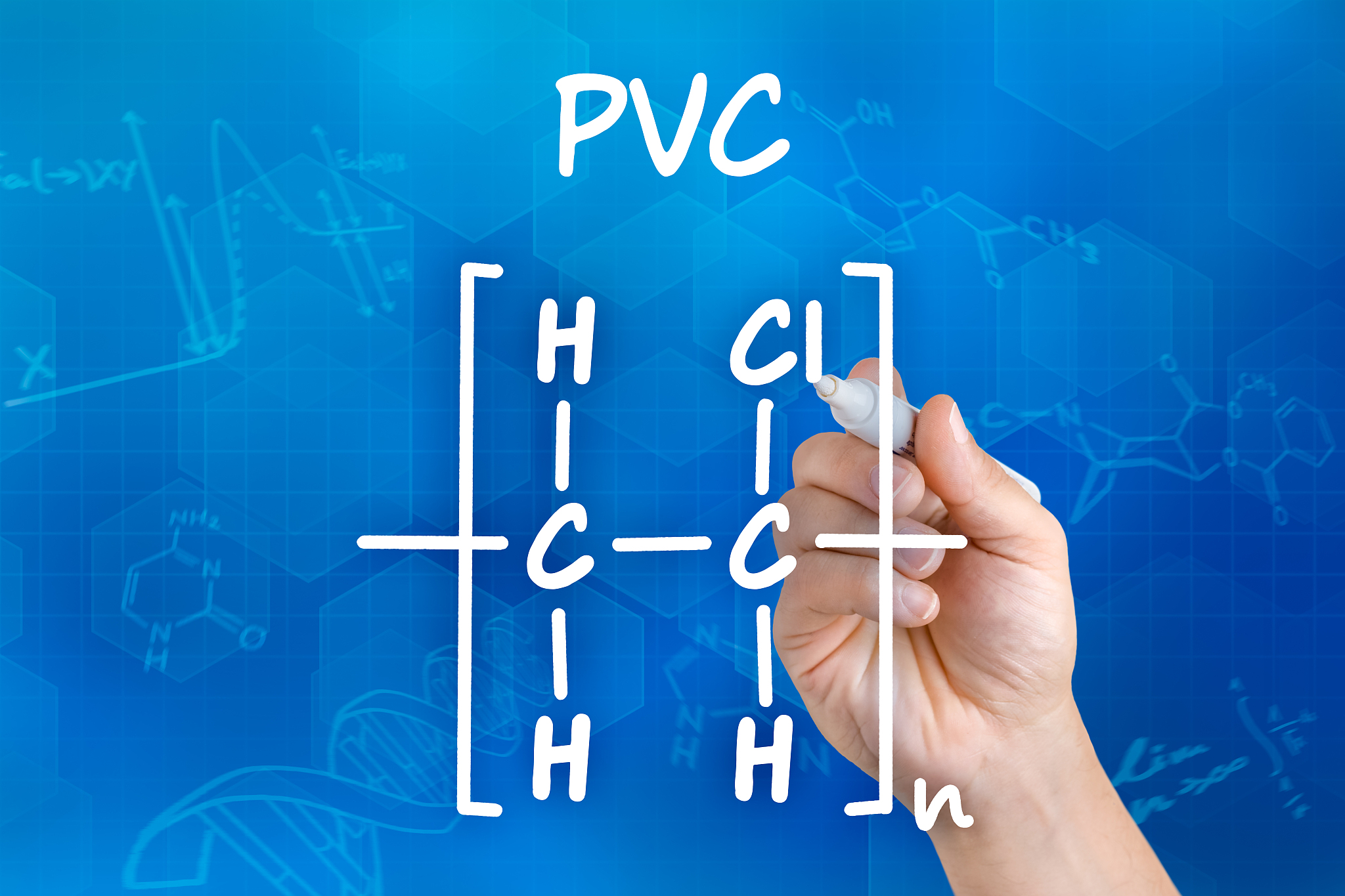 hand with pen drawing the chemical formula of pvc