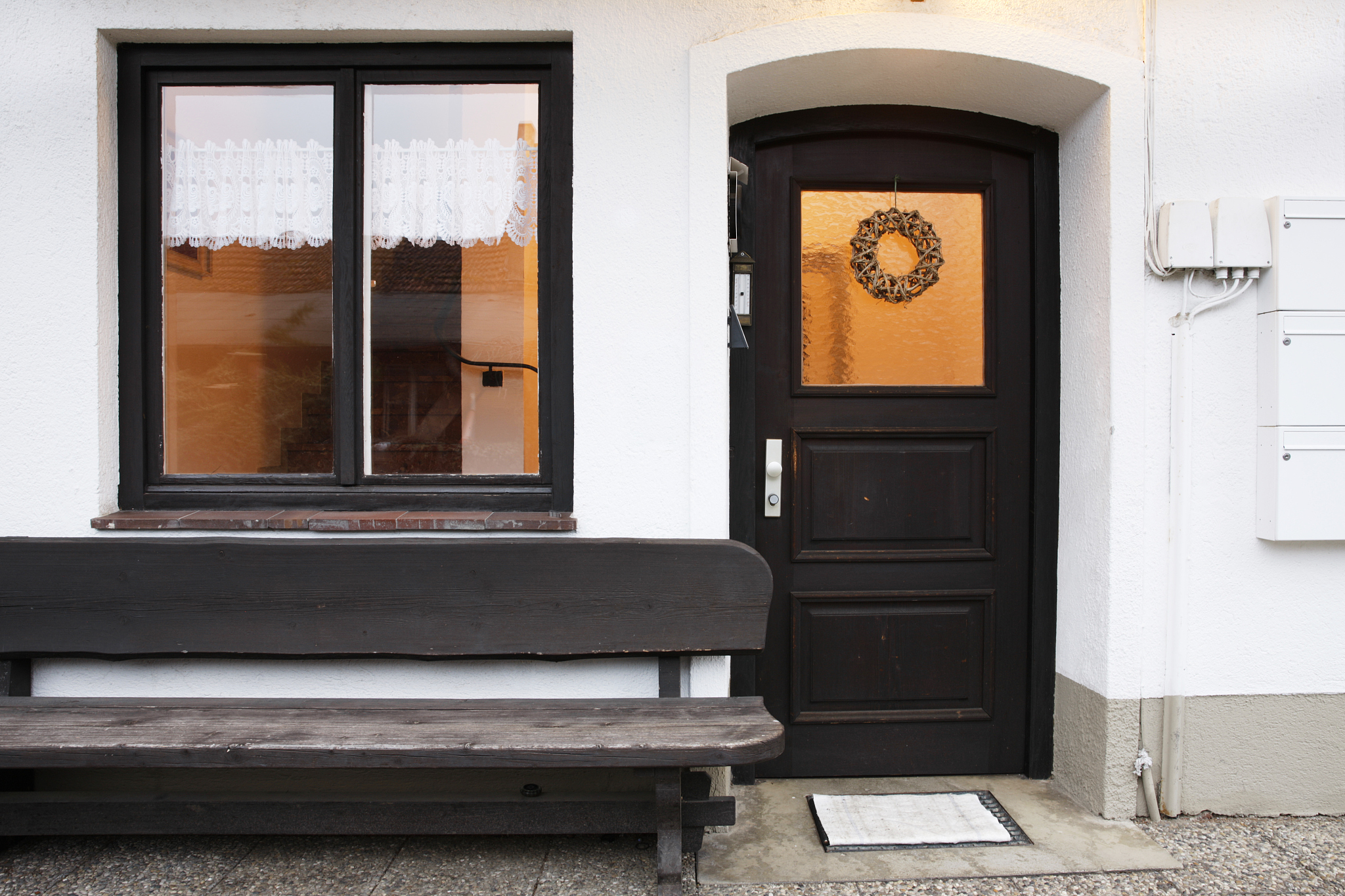 brown front door one third glass window, open