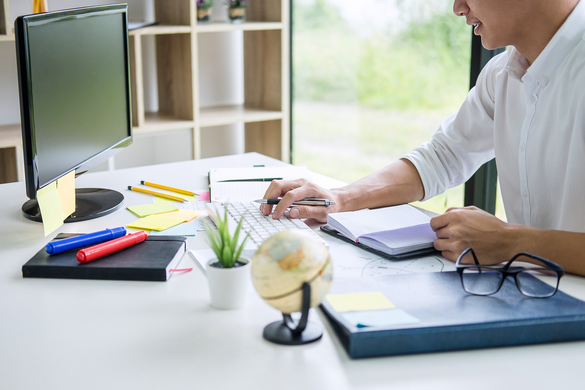 businessman working writing business plan document and graphic d