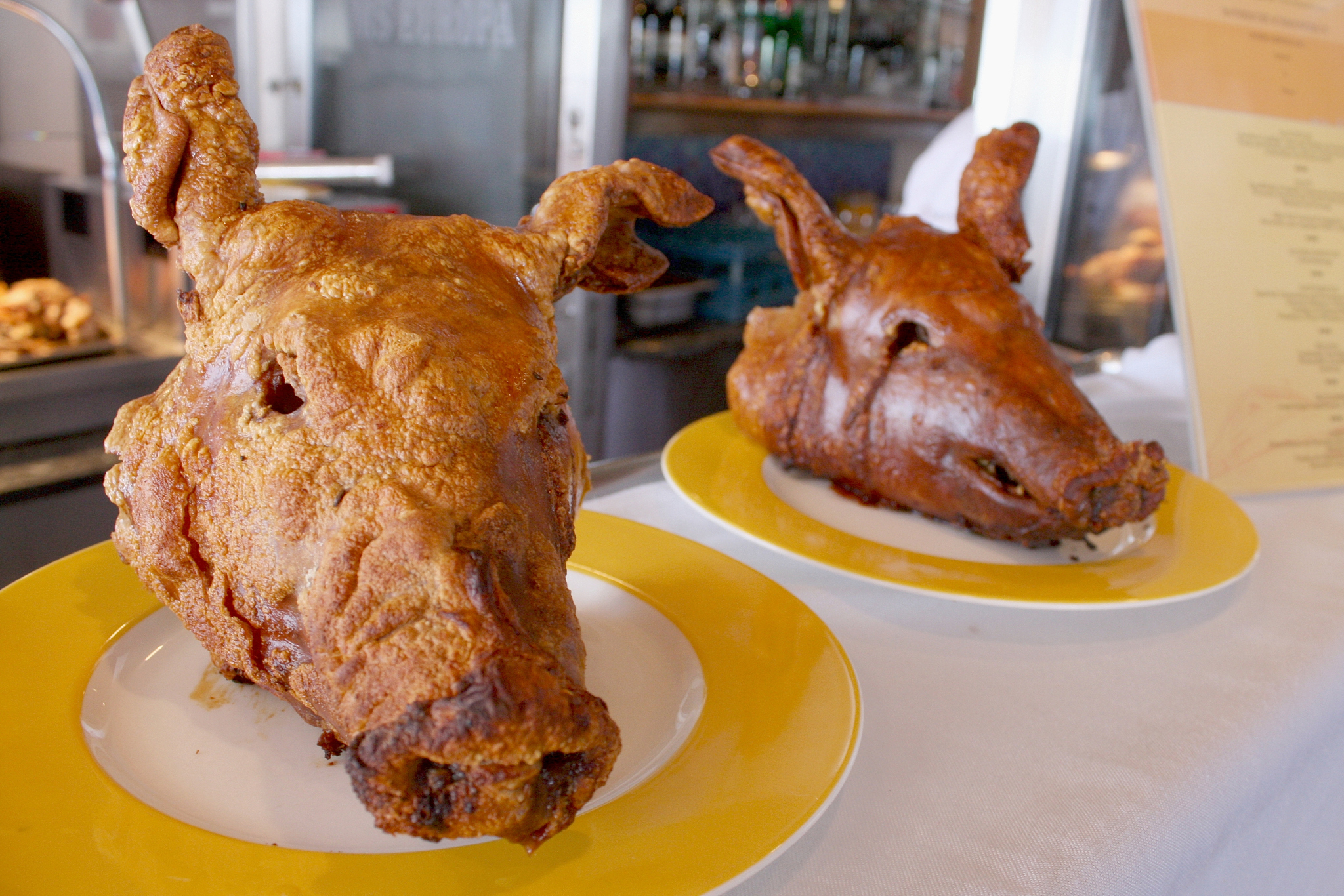 close-up of fried pork head in plate on table