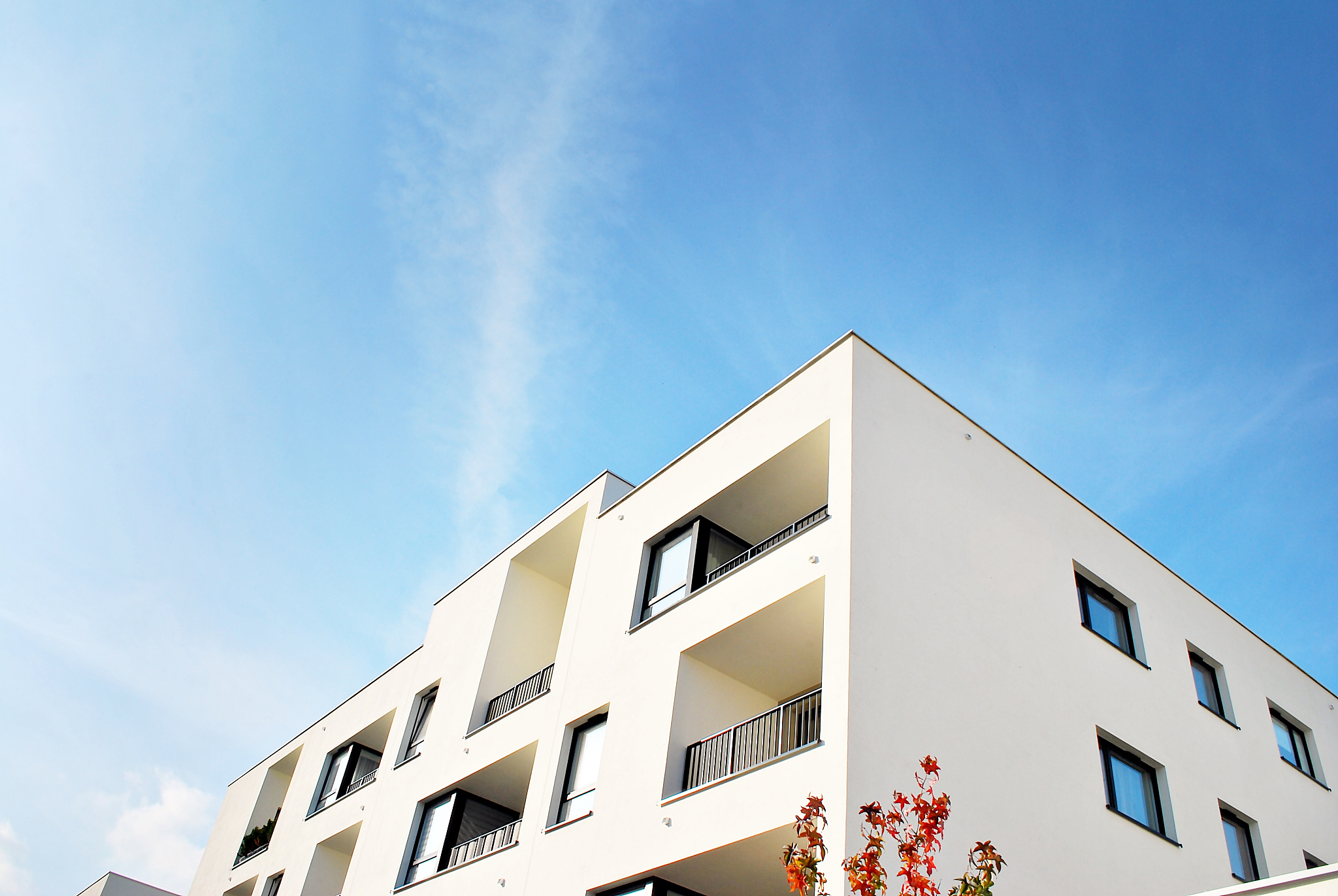 modern apartment buildings on a sunny day with a blue sky
