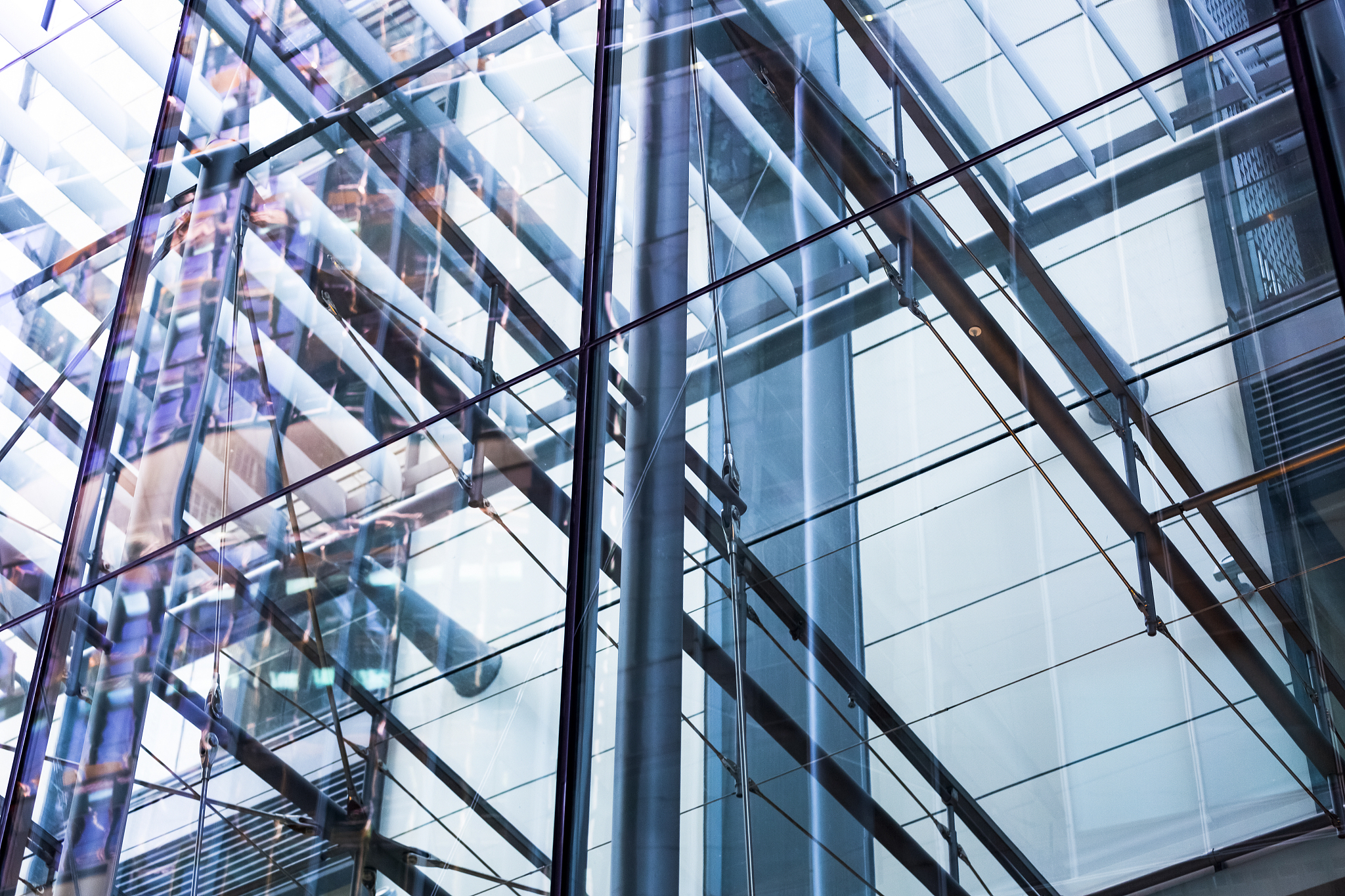 closeup glass office building metal structure and reflection, ba