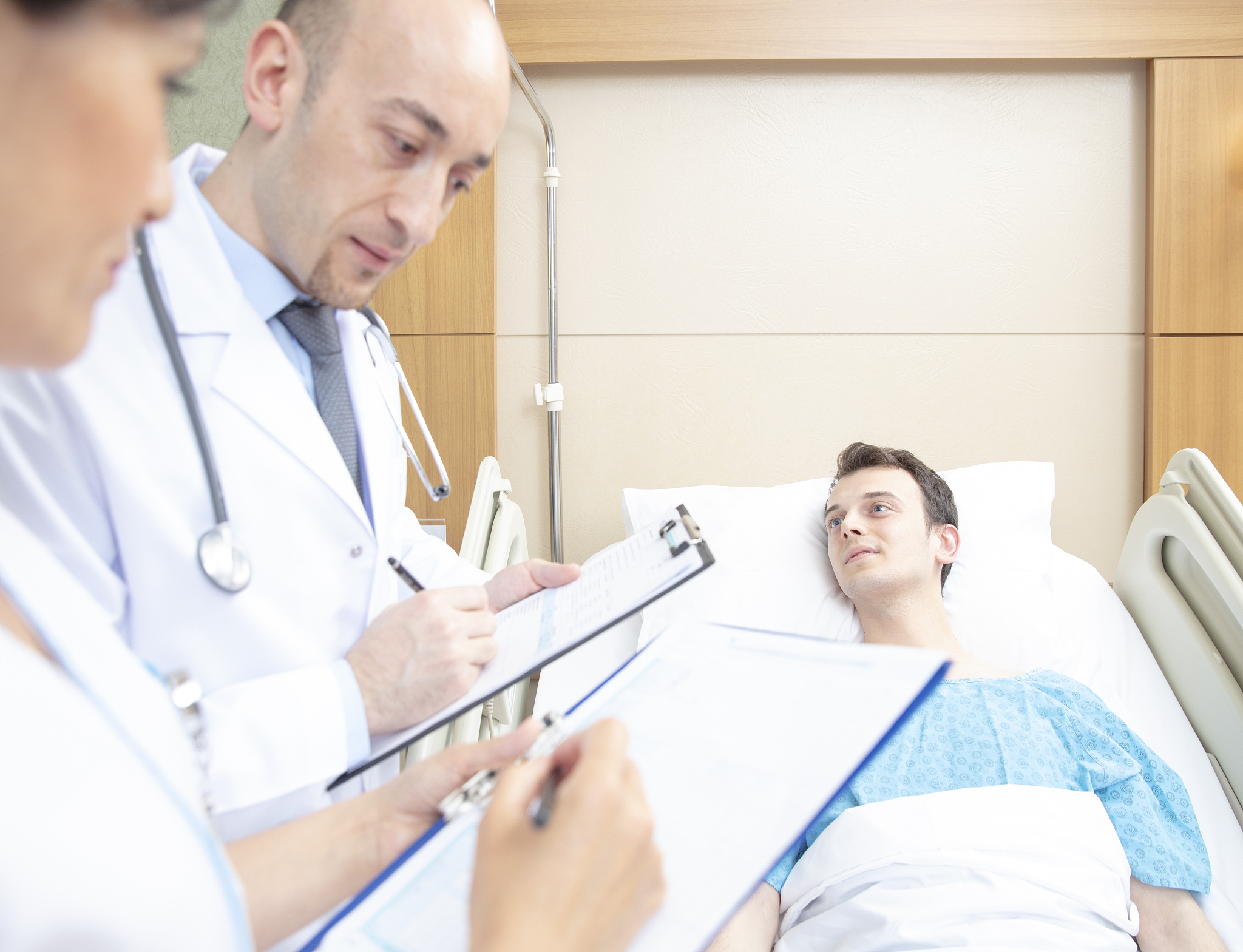 medical team visit patient in hospital