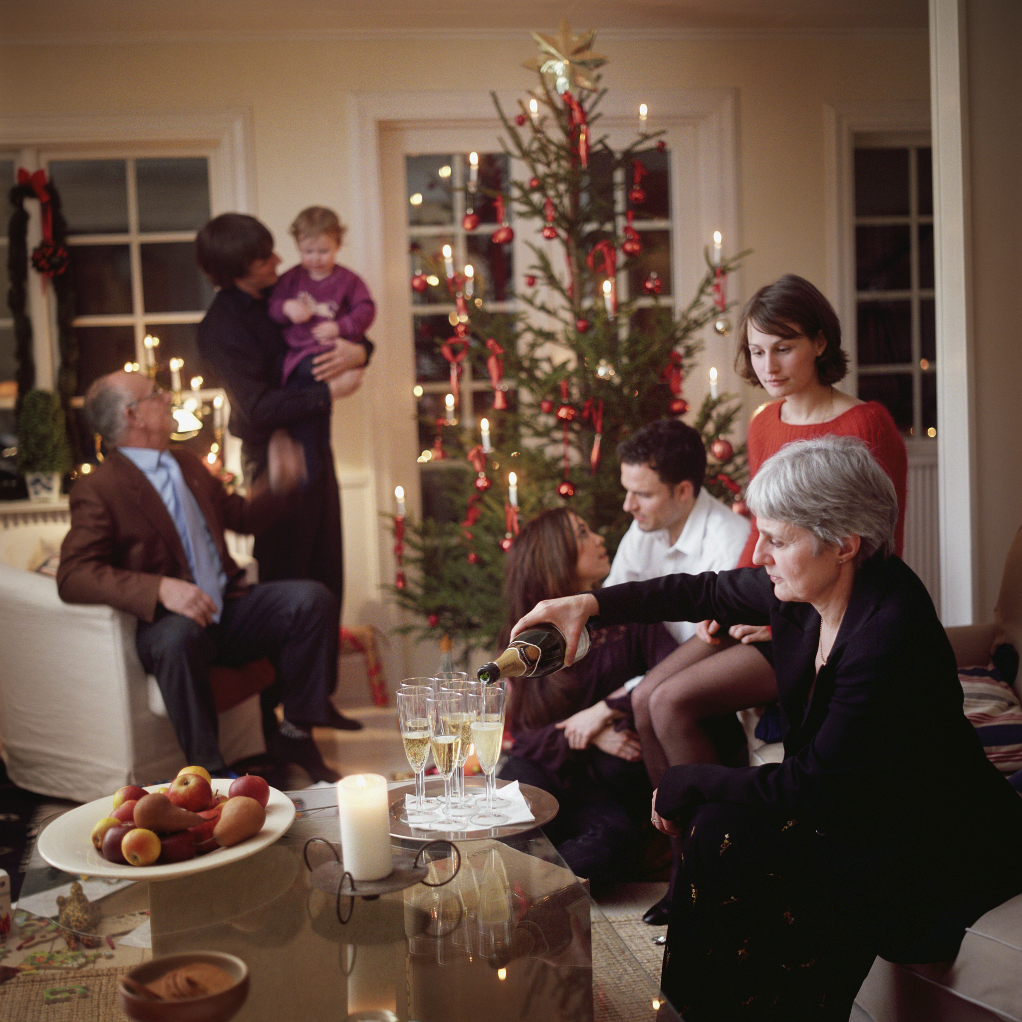 extended family around christmas tree