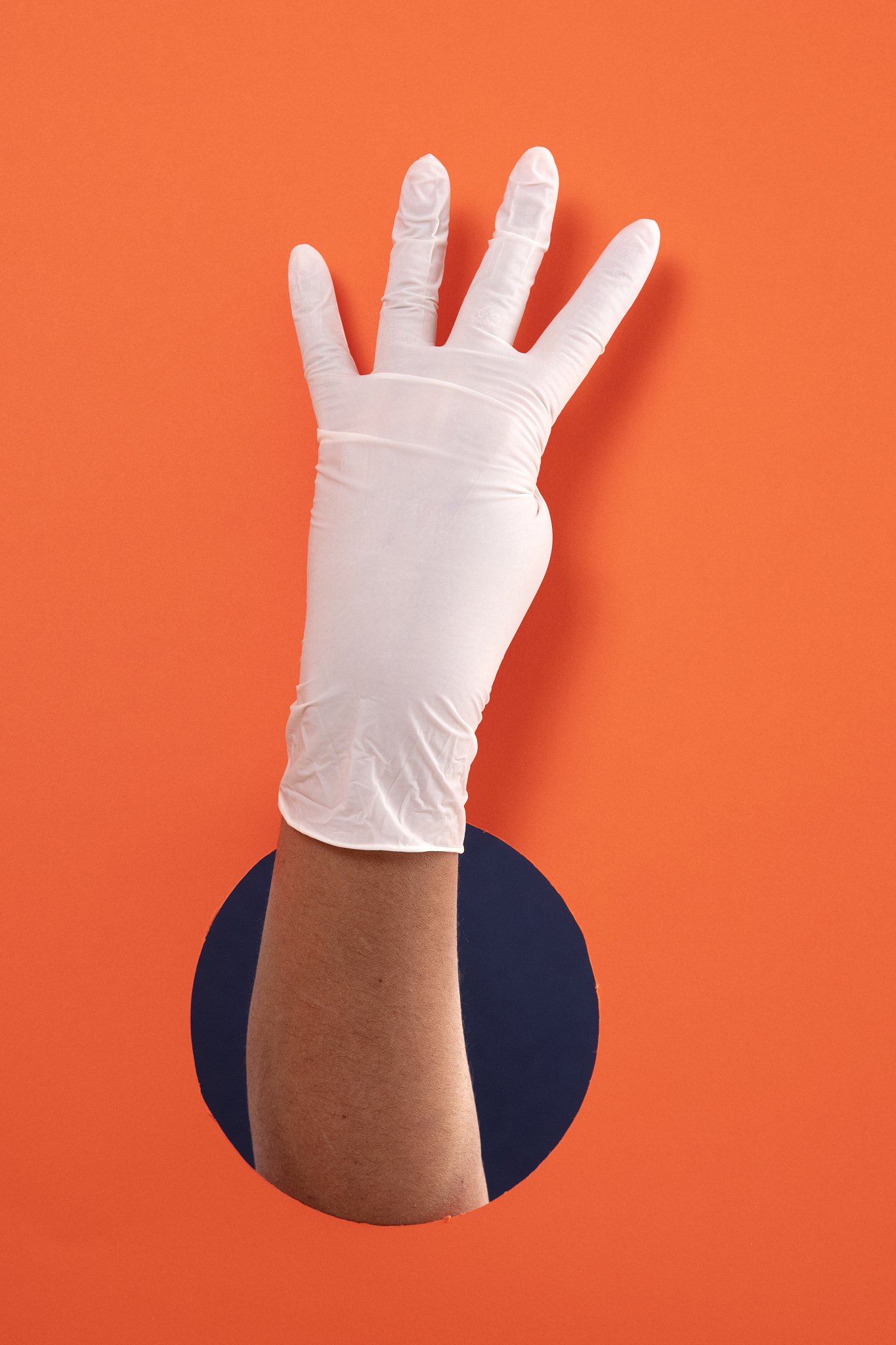 doctor hand with white medical glove showing number four with fi