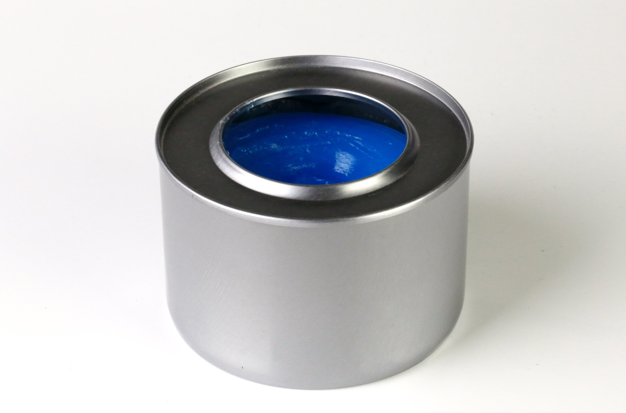 canned heat flame for warming chafing dishes on a white backgrou
