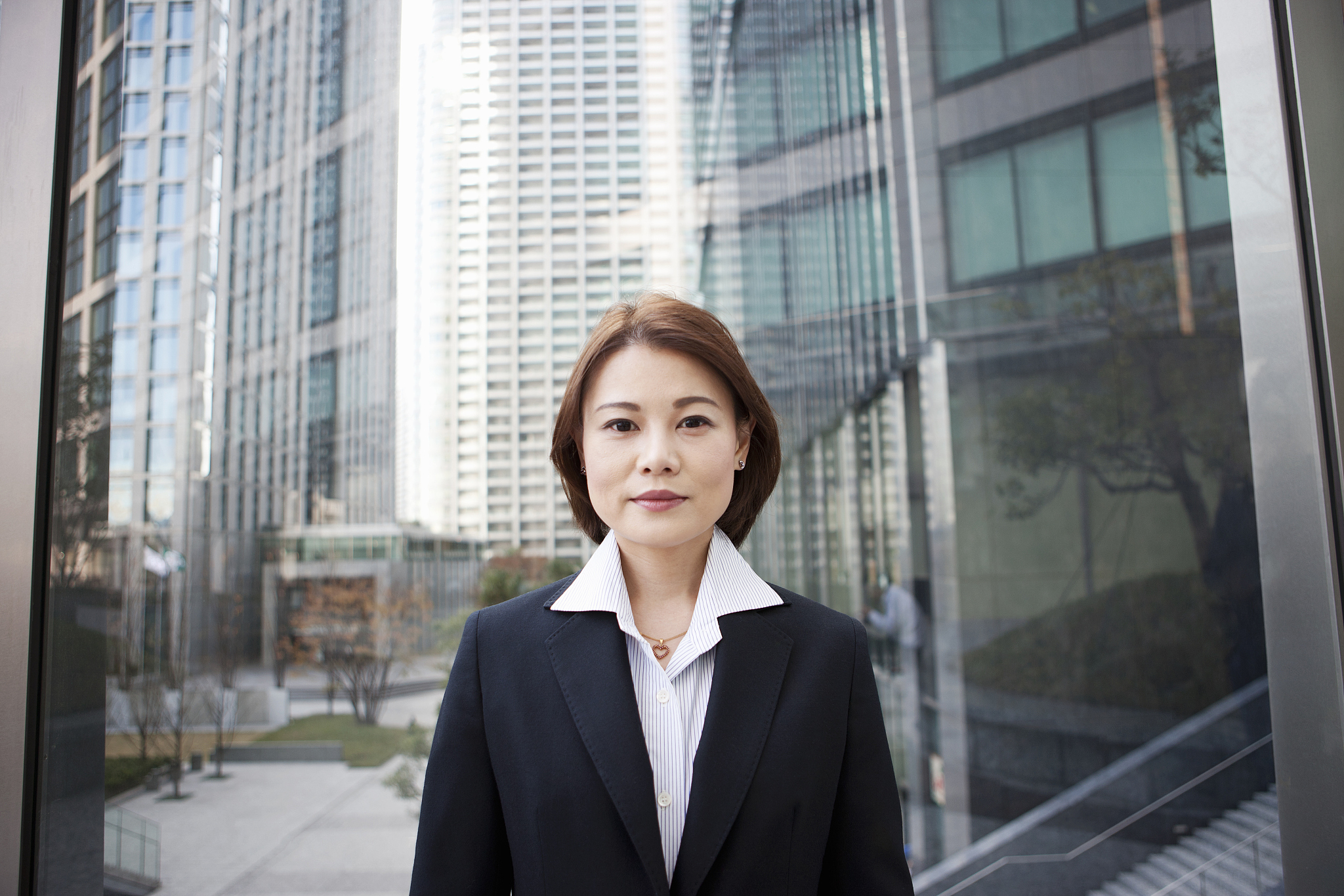 business woman in city with modern buildings