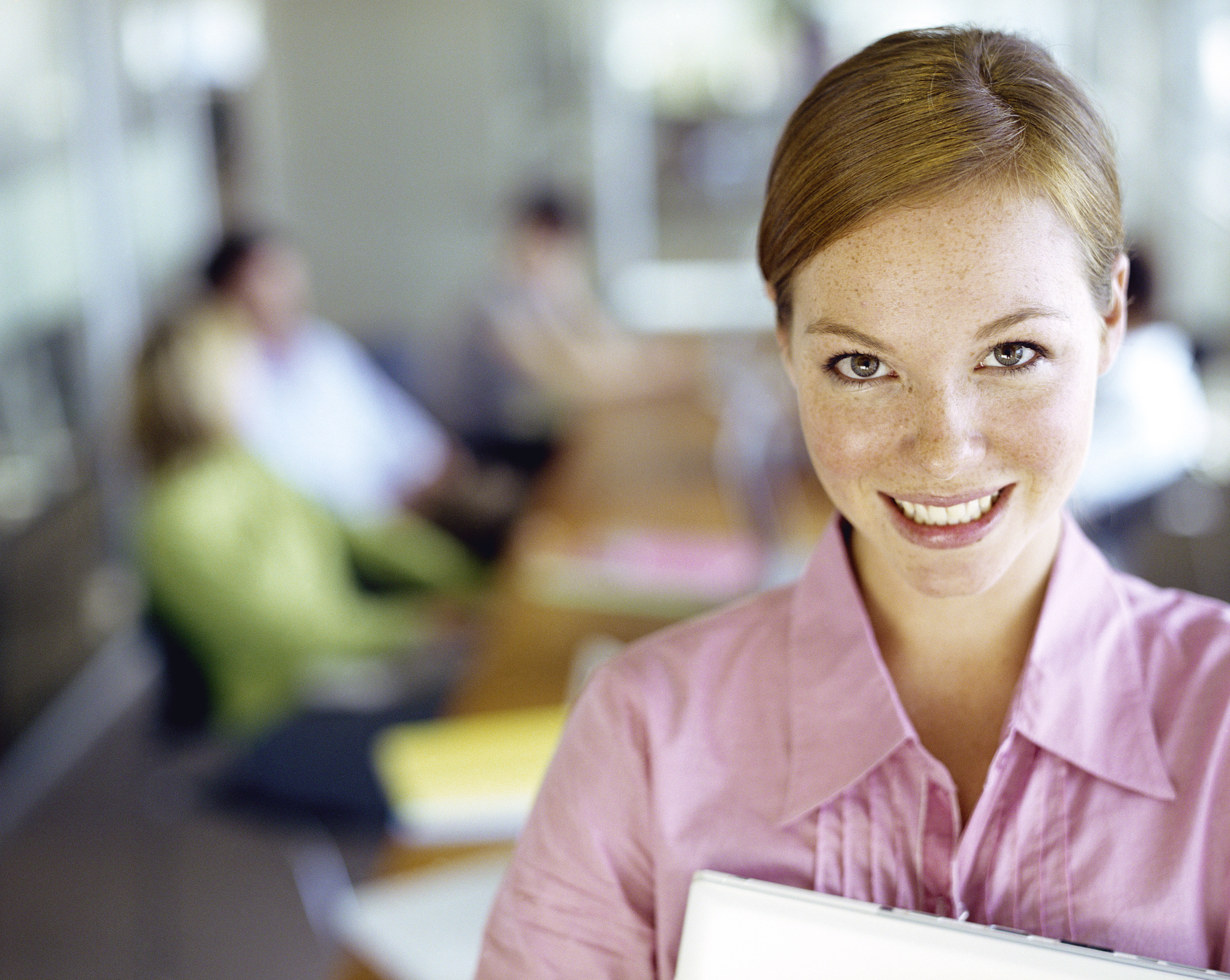 woman holding folders, standing in conference room, portrait, cl