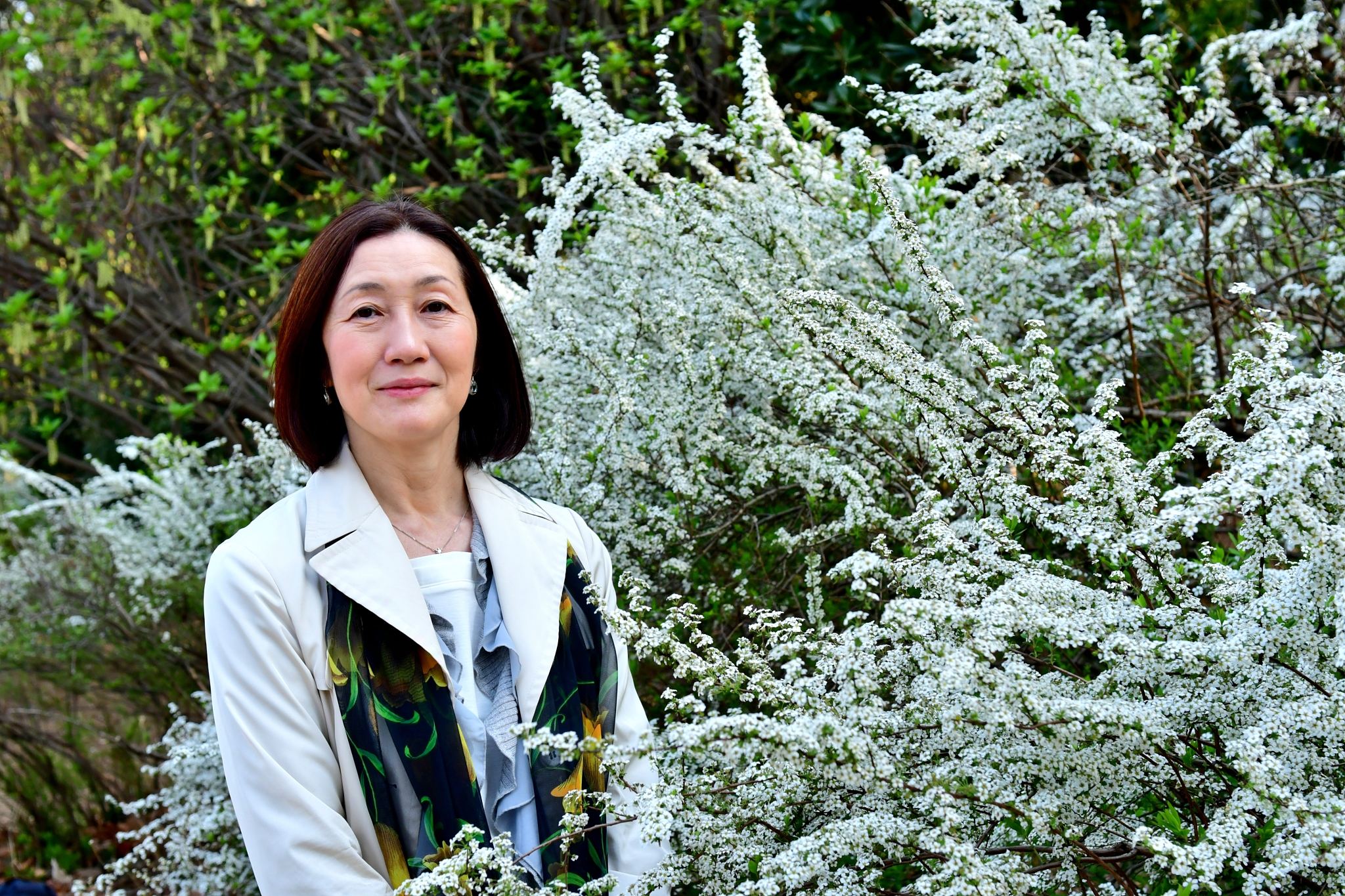 japanese woman posing in front of thunderberg's meadowsweet / sp