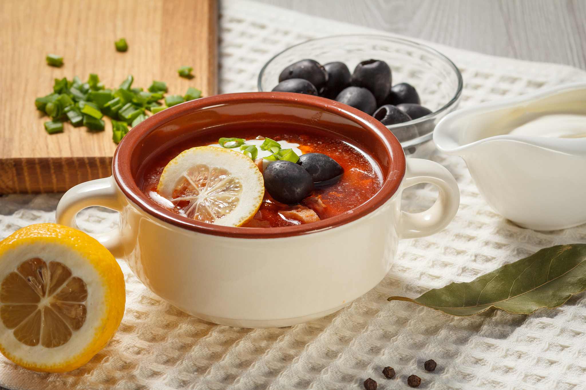 soup saltwort with meat, potatoes, tomatoes, lemon, black olives