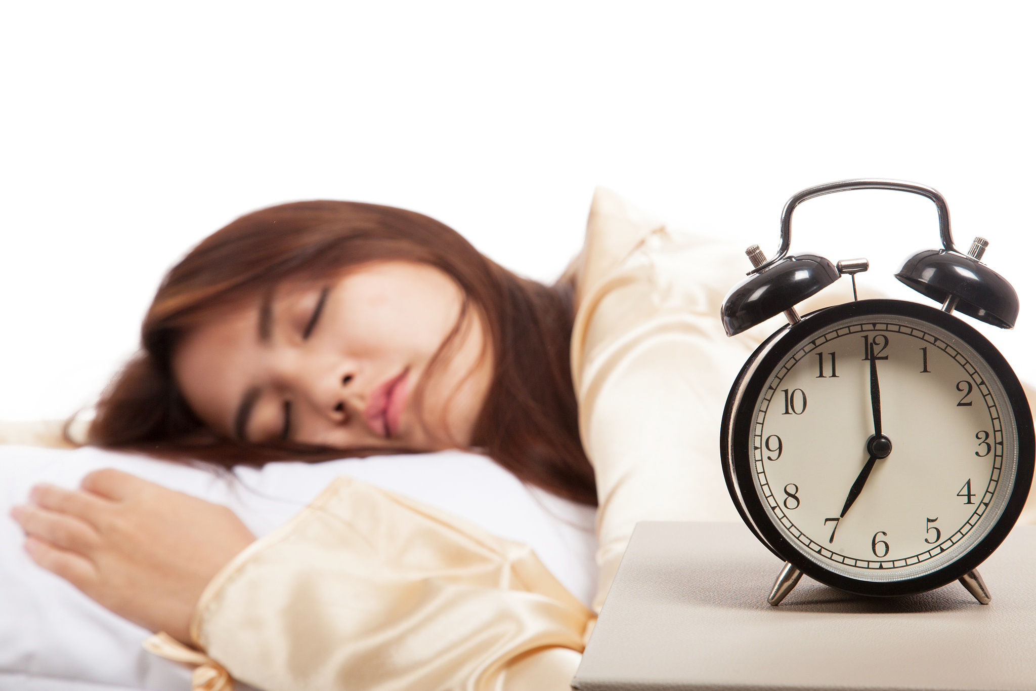 sleeping asian girl with alarm clock