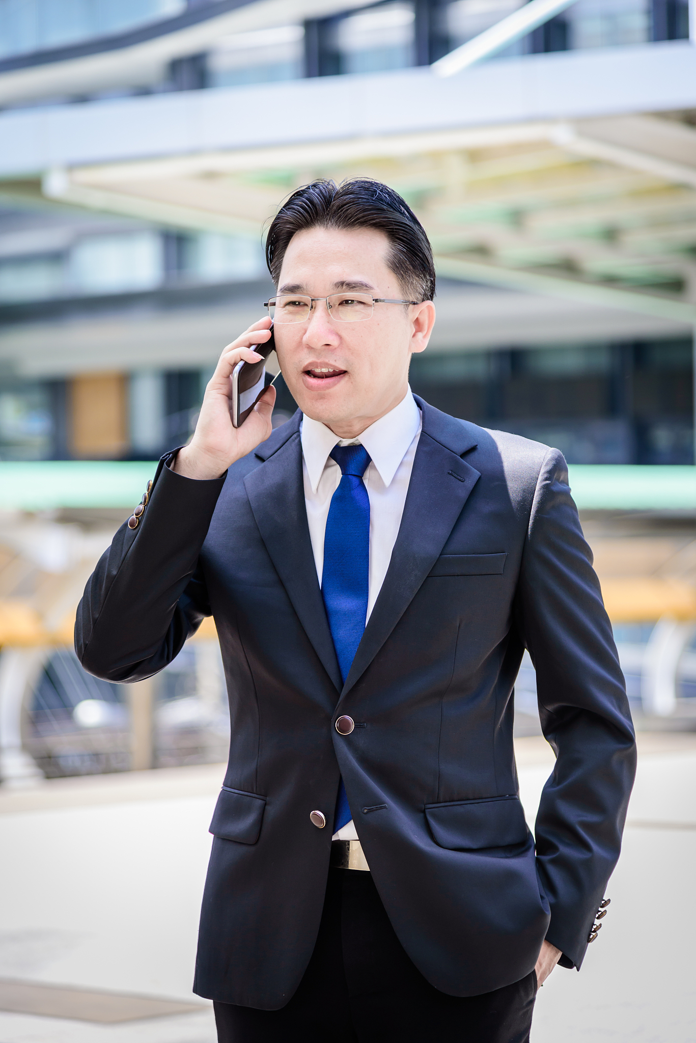 the asian businessman has working on mobile with happy.