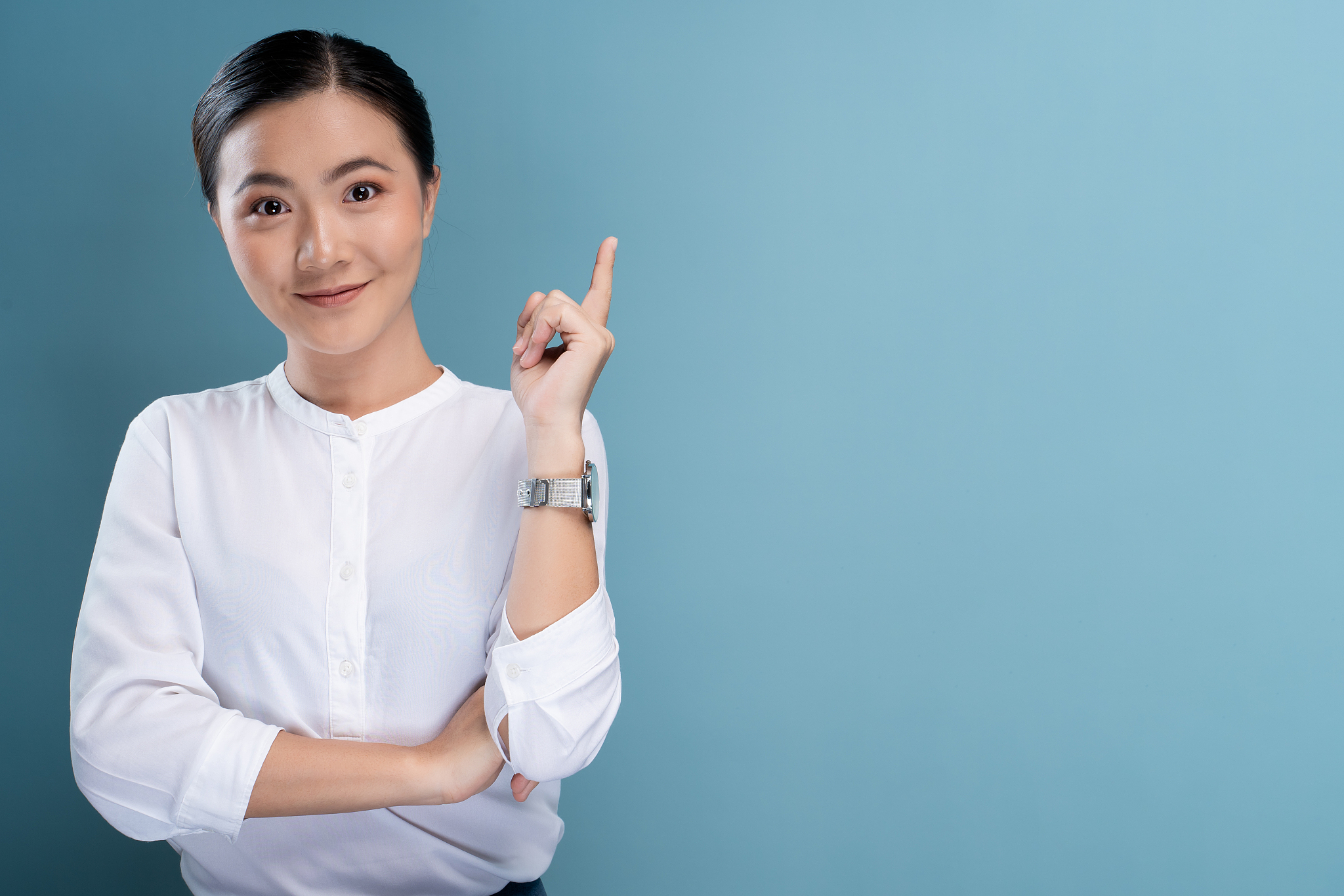 happy woman thinking and standing isolated over blue background