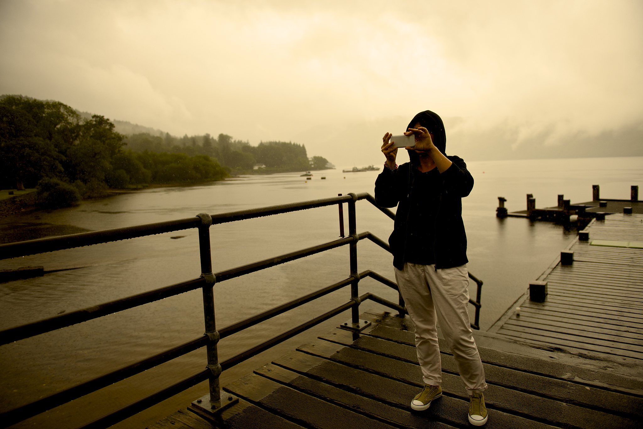 woman take picture in the lake