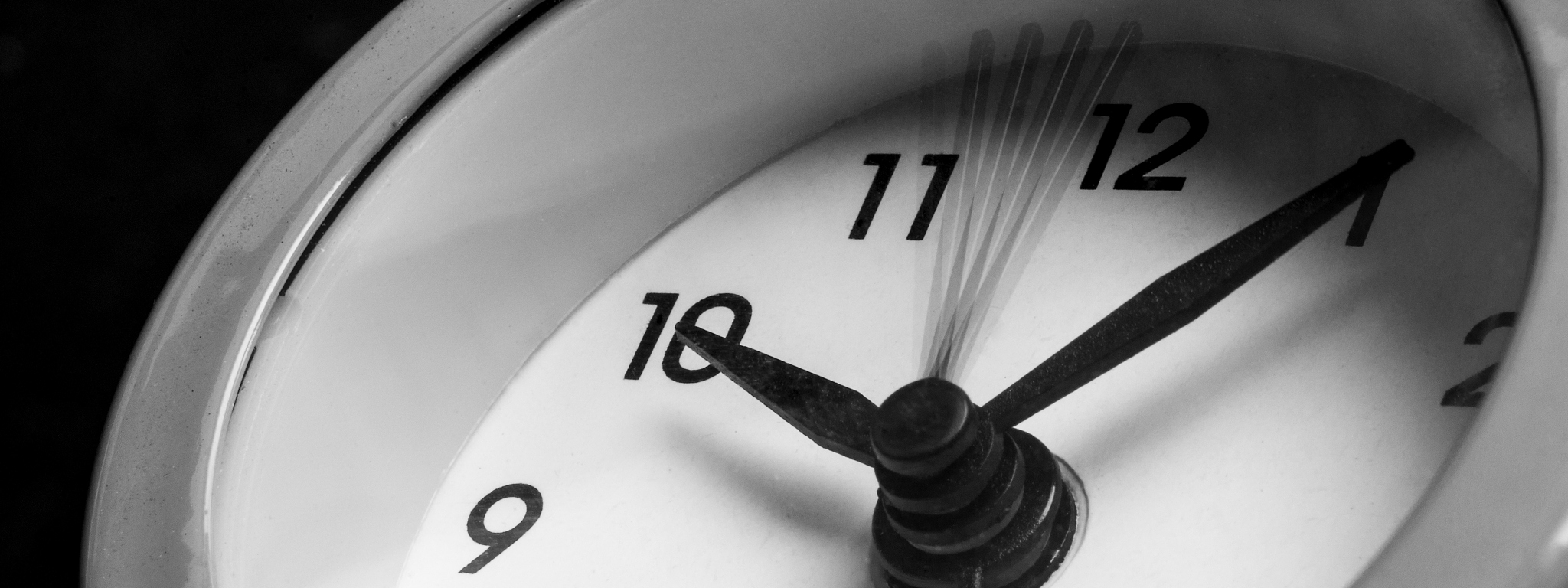 alarm clock on black background. time management concept.