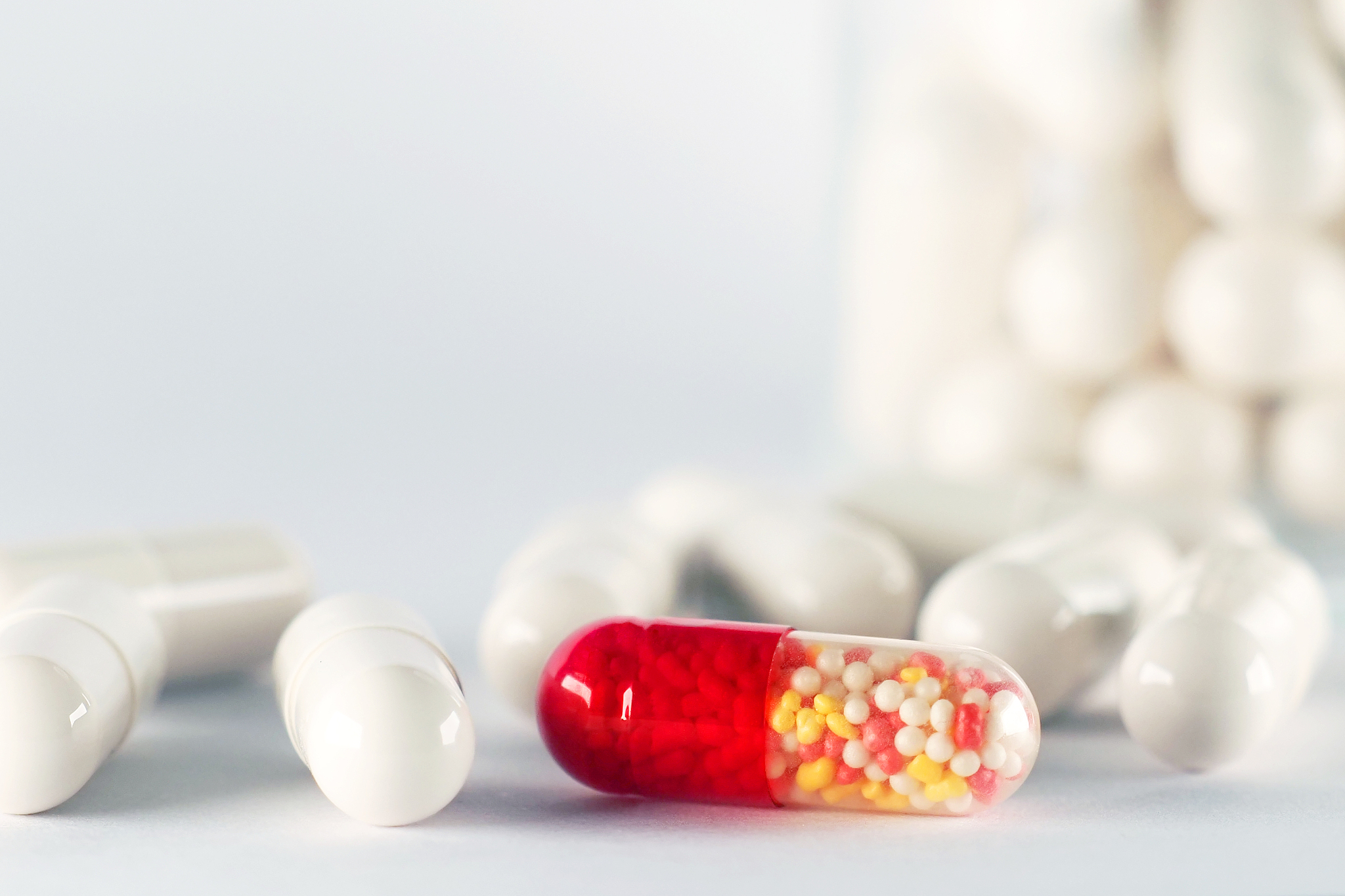 healthcare and medicine. capsules, pills. one standing out color